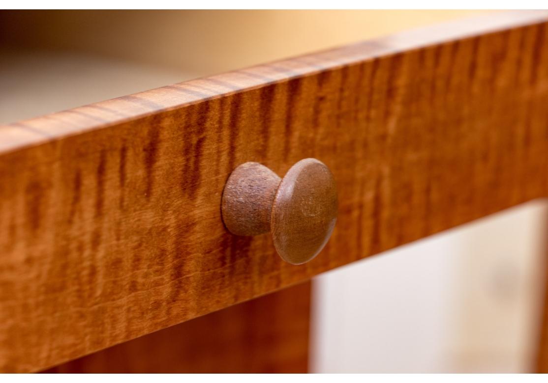 Exceptional craftsmanship from Connecticut based master craftsmen Ian Ingersoll. With references to Shaker designs, this Maple Nightstand Pair are everything that’s outstanding about simplicity. With tapered legs, two peg handled drawers