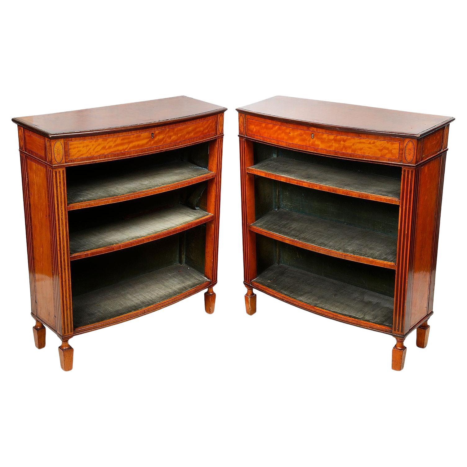 Fine pair of Sheraton revival bow fronted open book shelves.