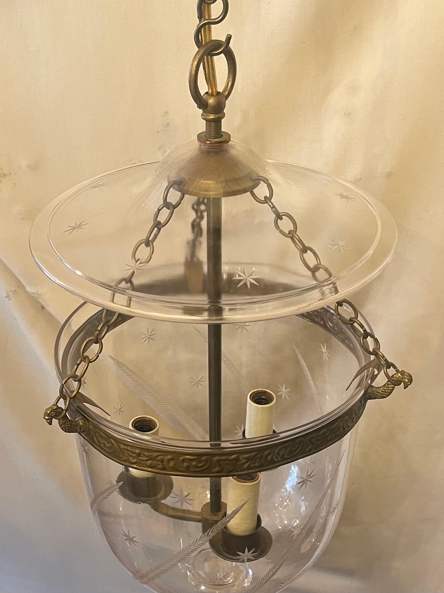A Fine Regency Style Vaughan Designs English Brass / Bronze Blown Glass Bell Jar Lanterns With Stars And Feathers Etched In The Bell And Stars On The Glass Top Plate, Fitted With 3 Candelabra Lights.
Vaughan Designs Item # Code: CL0308.BR

