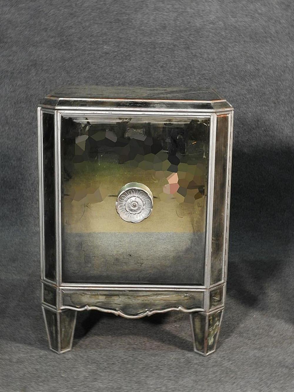 These are wonderful Italian made silver leaf églomisé nightstands. They are in good condition but as is typical with mirrored furniture, they will have subtle signs of age and small stabile cracks in the glass. They measure: 28