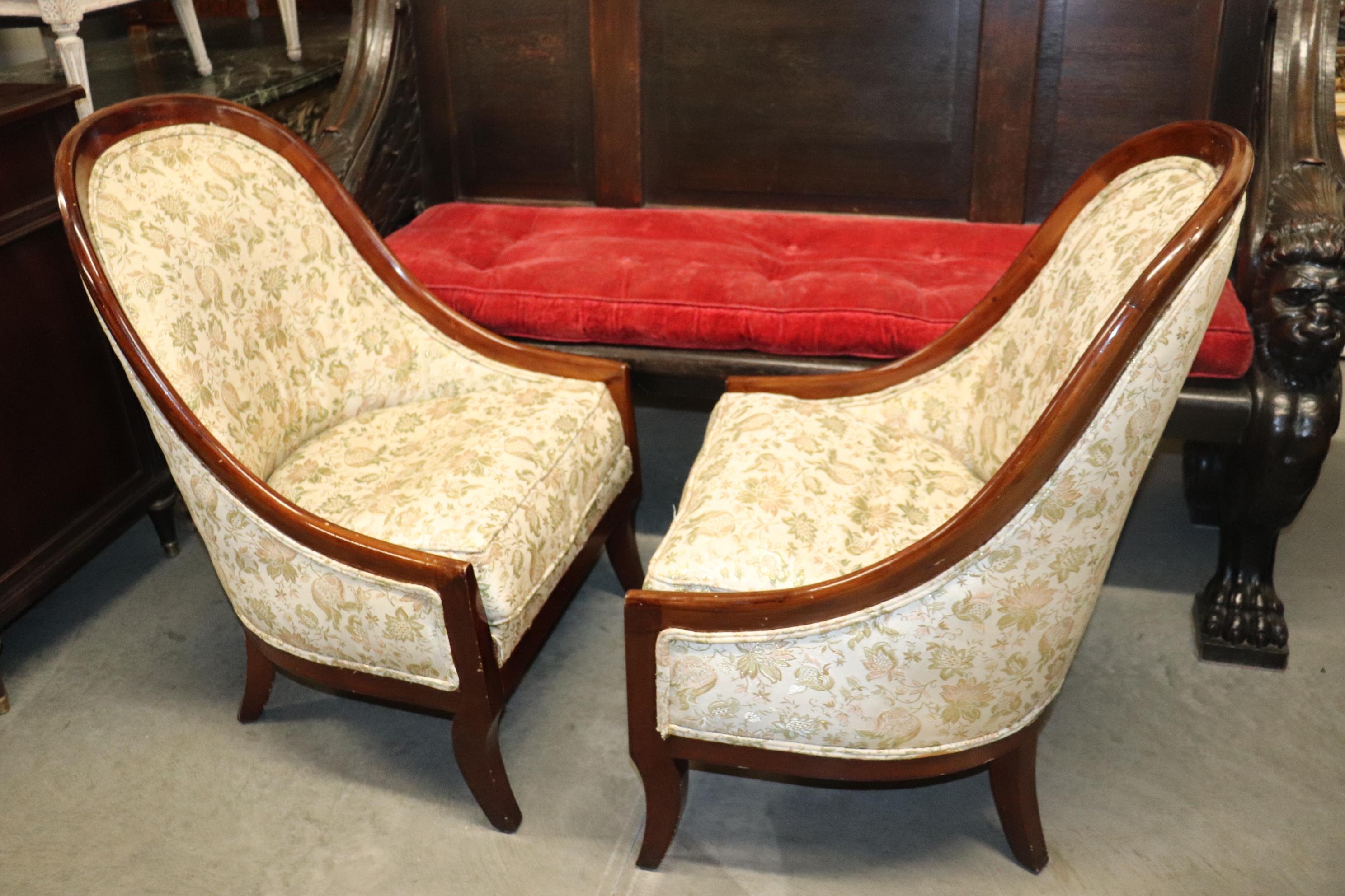 This is a fantastic pair of English Regency style tub bergere chairs. They are know for their incredible comfort and rakish handsome looks. The chairs are in good condition with nice older upholstery and measure 38 tall x 24 deep x 25 wide x 18 inch