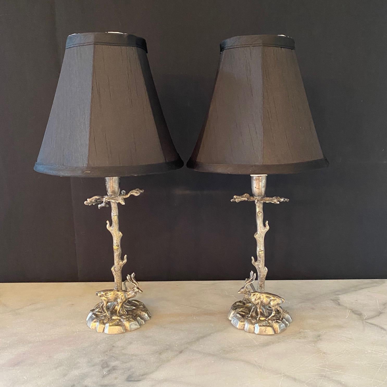 Pair of finely sculpted Valenti style stag table lamps, unsigned. Midcentury quality solid silvered plate on bronze sculpture most likely by the highly sought after Spanish artist Valenti. These sculptures depict a wild stag or deer on each lamp