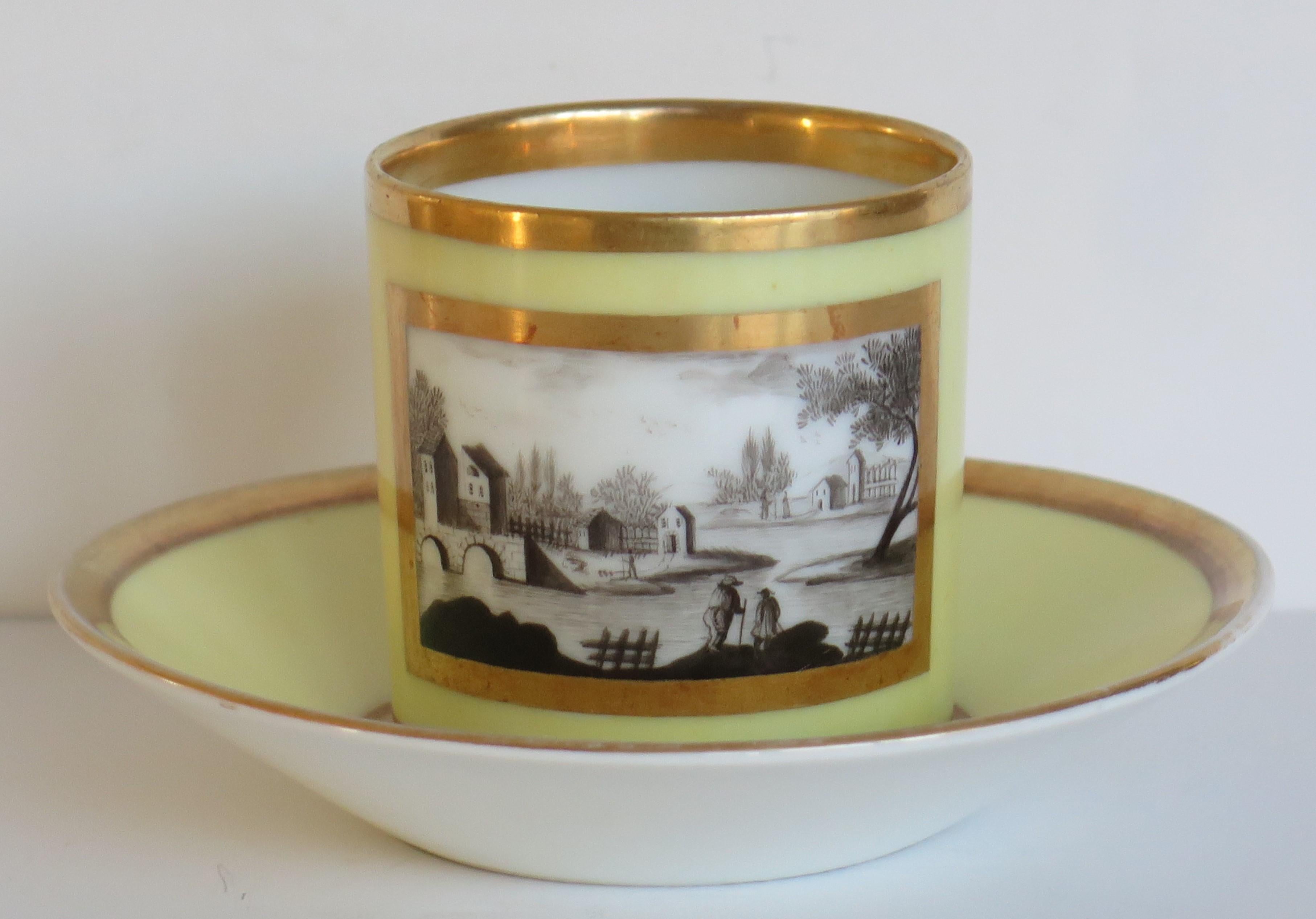 This is a very beautiful porcelain coffee can and saucer, made by a French Paris maker, dating to the very early 19th century, circa 1800.

The coffee can is carefully hand painted 