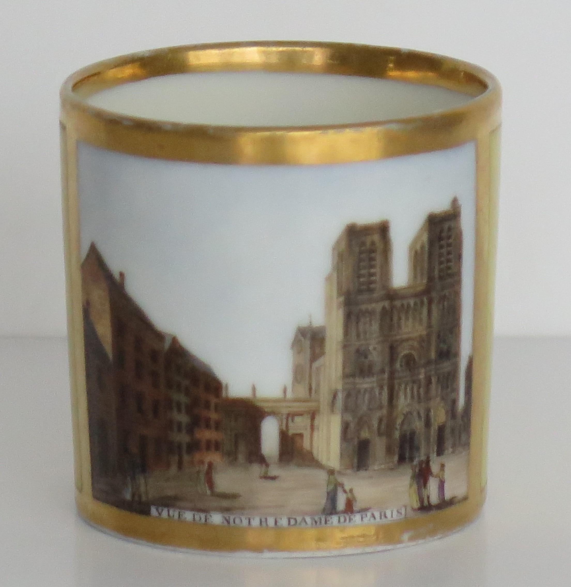 This is a very beautiful porcelain coffee can with a hand painted scene of Notre-Dame Cathedral, made by Paris, France, dating to the late 18th century, circa 1795.

The coffee can is broadly cylindrical tapering slightly to the base, with a ring