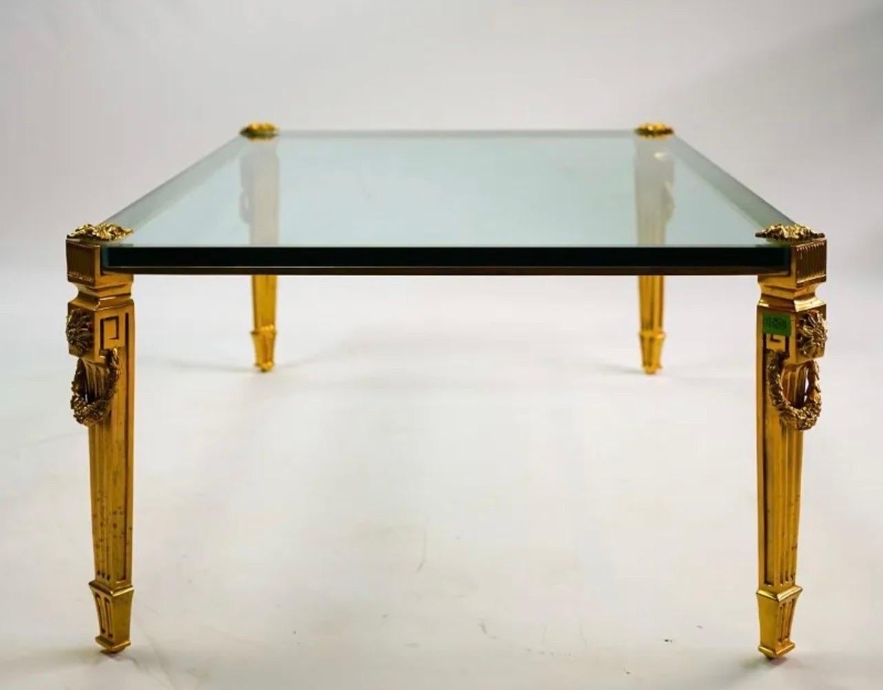 A fine gilt bronze P.E. Guerin Louis XVI style with ormolu garlands & rosettes over fluted legs glass top coffee / cocktail table