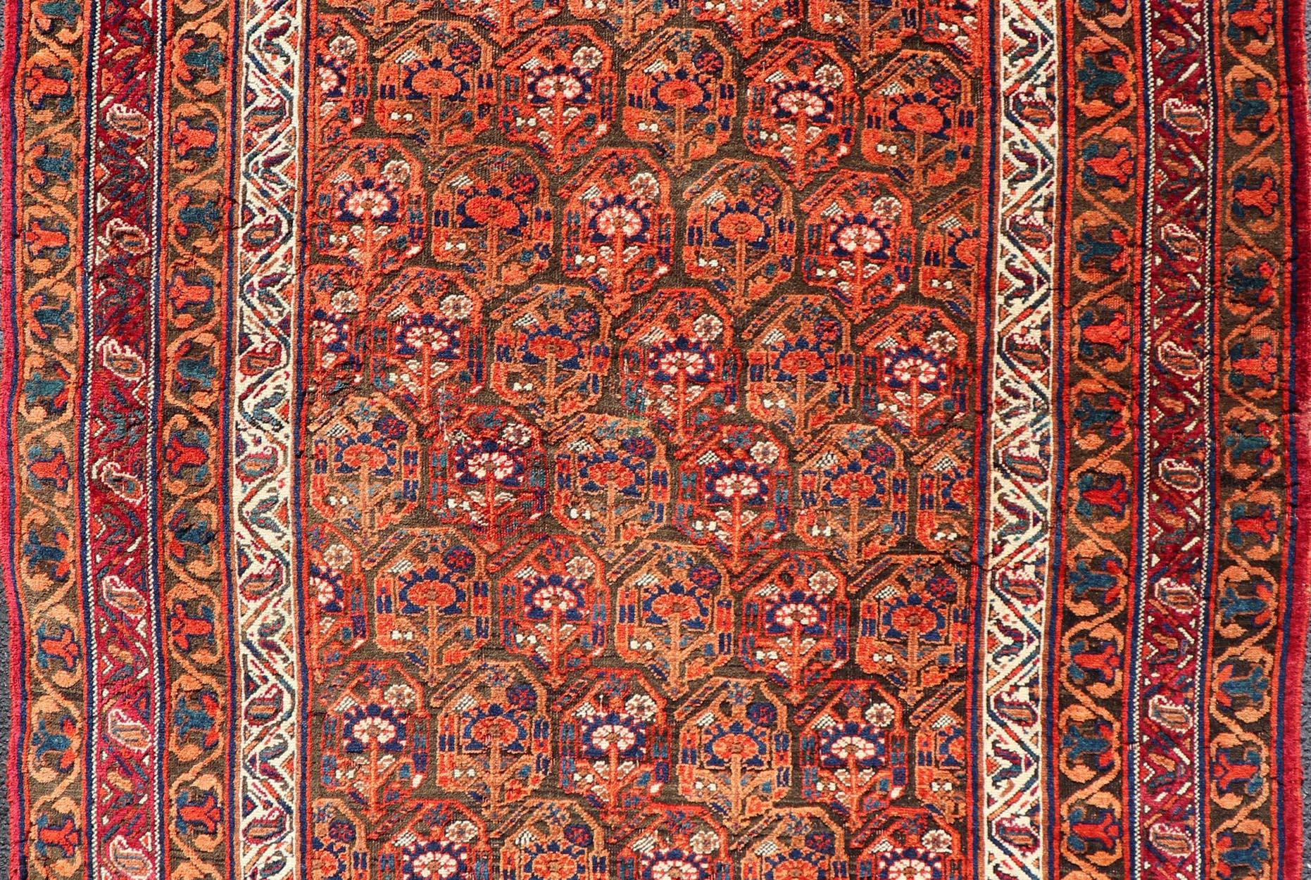 Laine  Tapis persan ancien Afshar à fond orange et cuivre et multicolore en vente