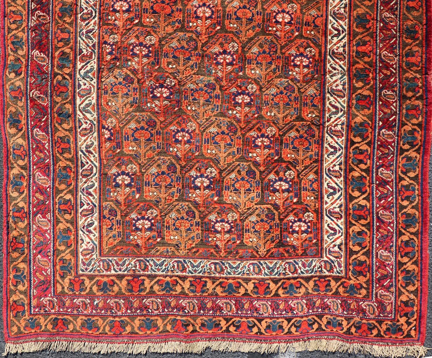 Tapis persan ancien Afshar à fond orange et cuivre et multicolore en vente 1