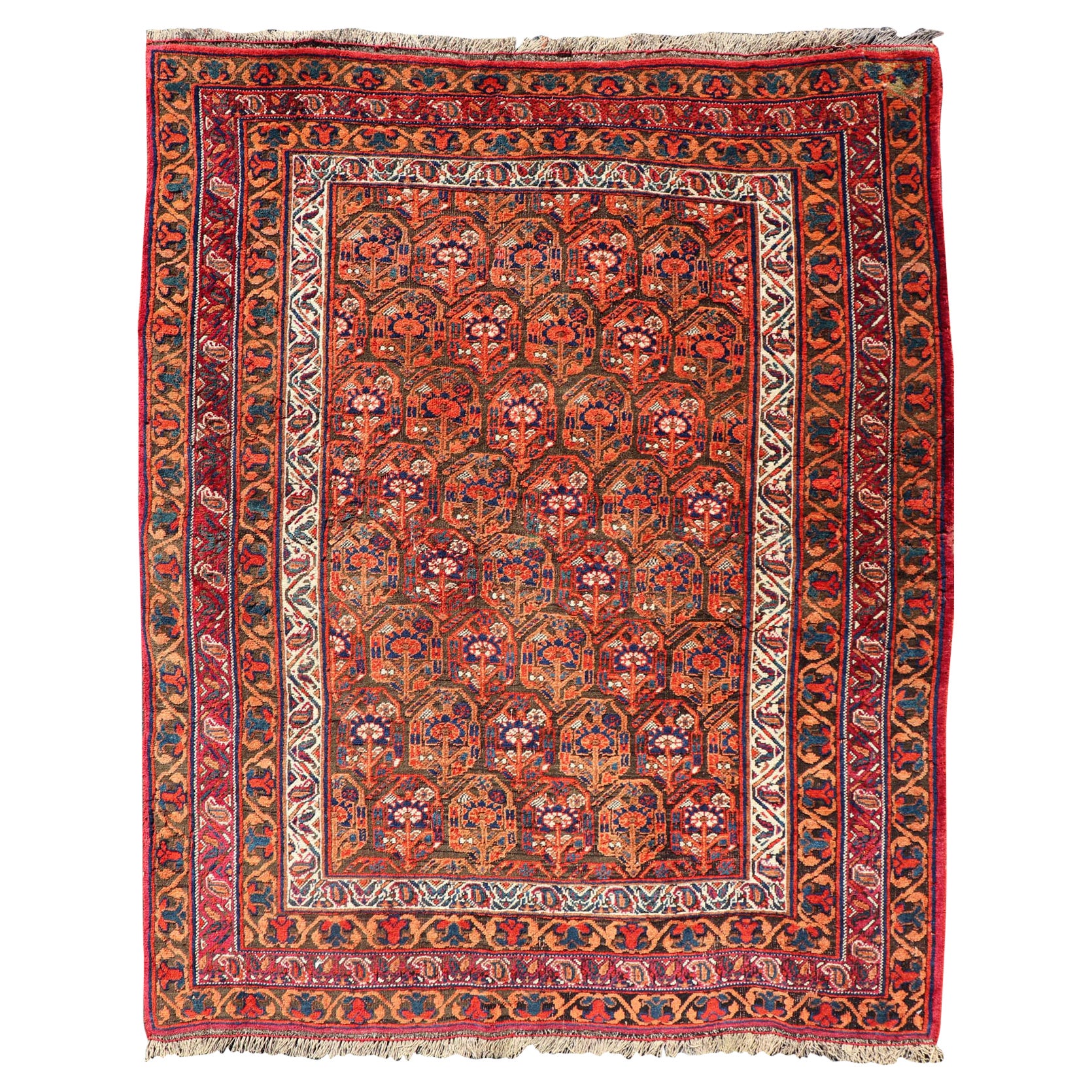 Tapis persan ancien Afshar à fond orange et cuivre et multicolore