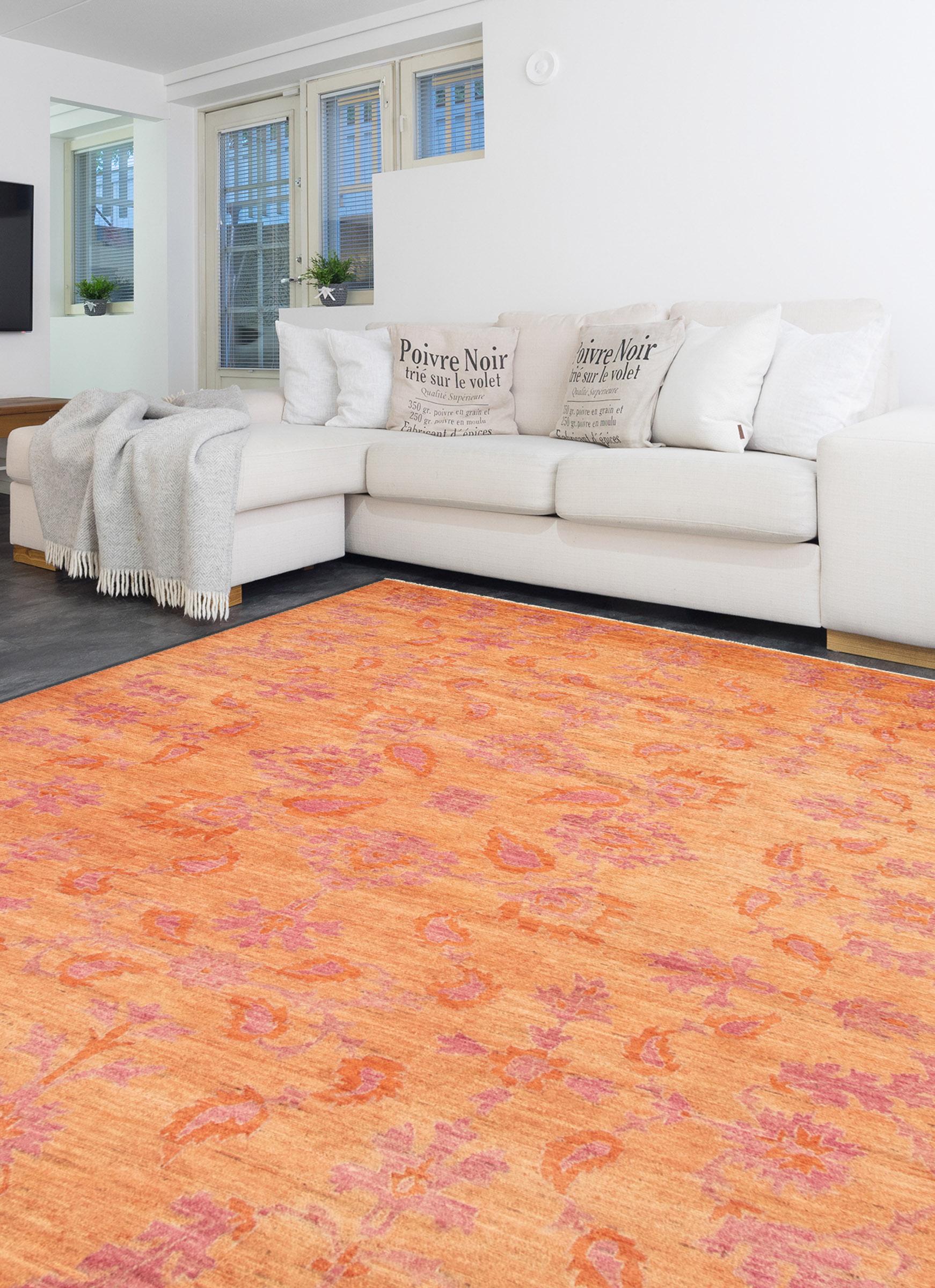 Detailed by bright and inviting shades of pink and orange wool, this hand-knotted carpet measures 10'3