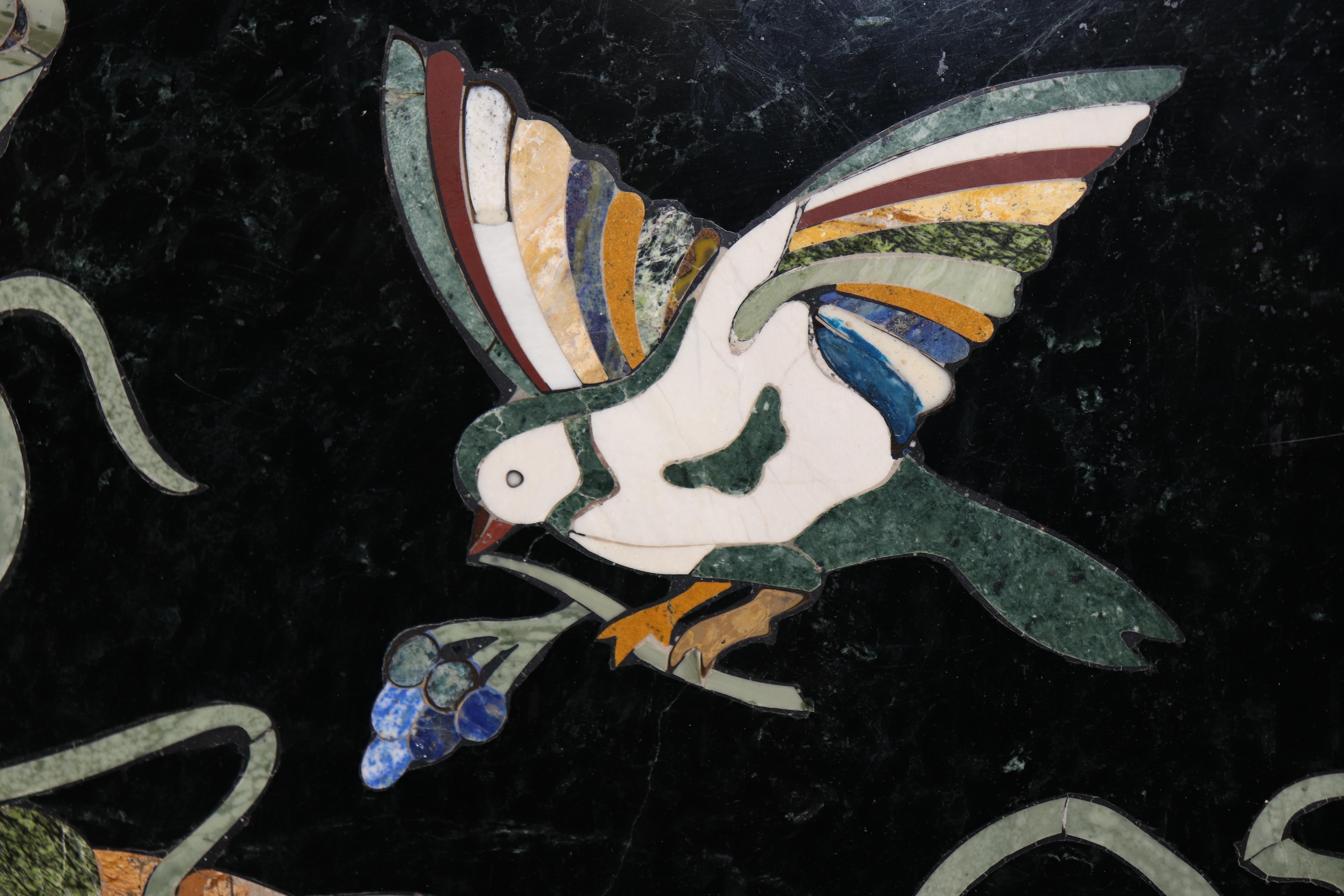 This is a table top only no base is provided.

This is a gorgeous  table top, featuring superb inlaid birds, flora and fauna and grapes and beautiful leaves. The top is perfect for any pedestal that supported a glass top and are commonly available