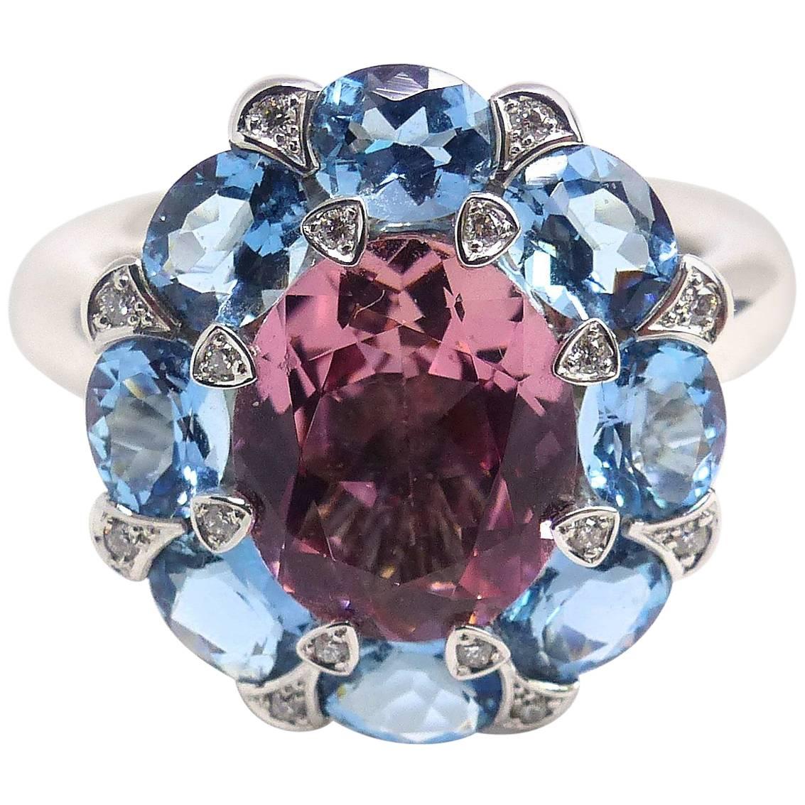 Ring in White Gold with 1 Pink Tourmaline and 8 Aquamarines and Diamonds. For Sale