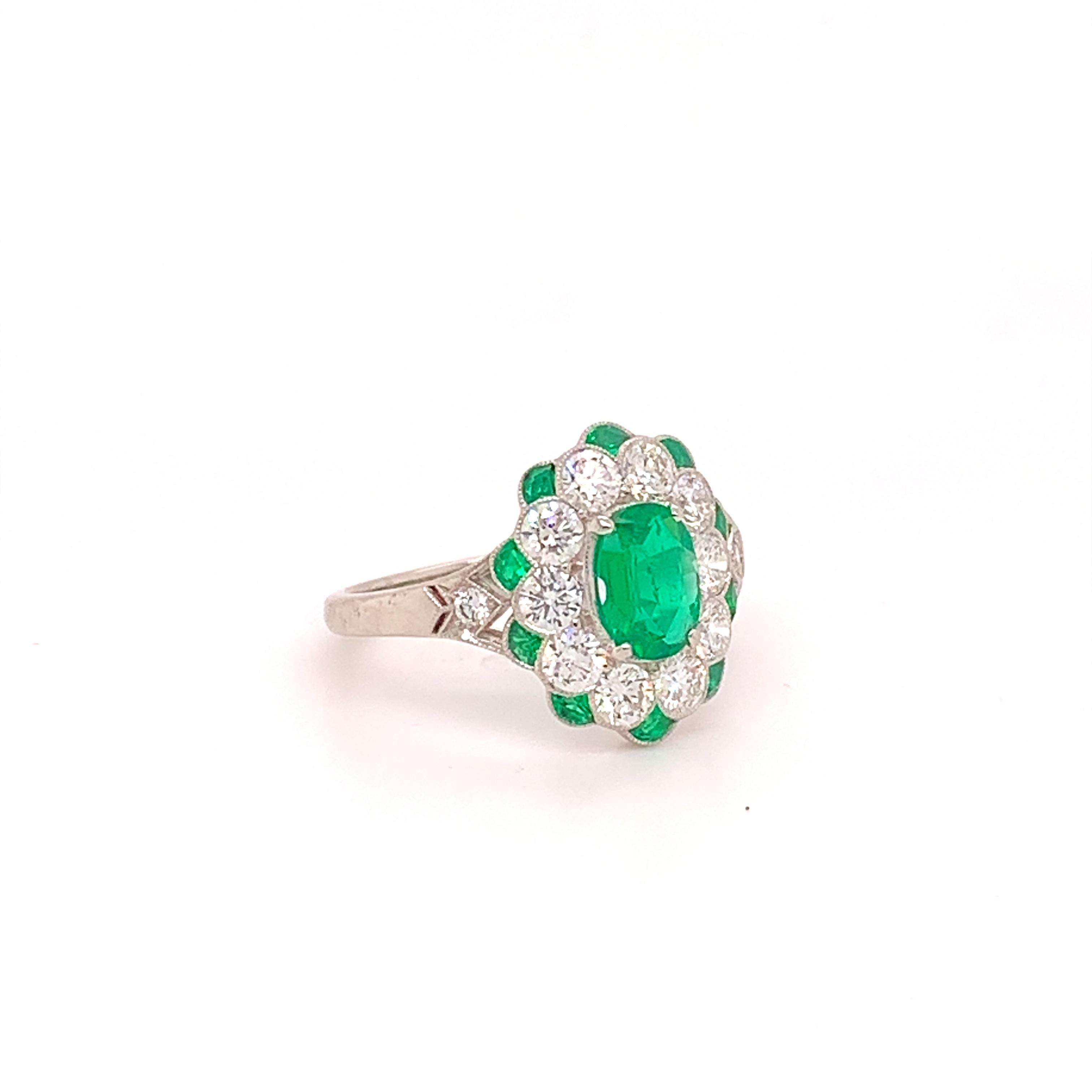 Fine Platinum Genuine Natural Emerald and Diamond Ring (#J4857)

Platinum emerald and diamond ring with specialty cut emerald accents, 1.50 carats total weight emeralds, top color and clean, almost 1ct in round brilliant cut diamonds, exactly