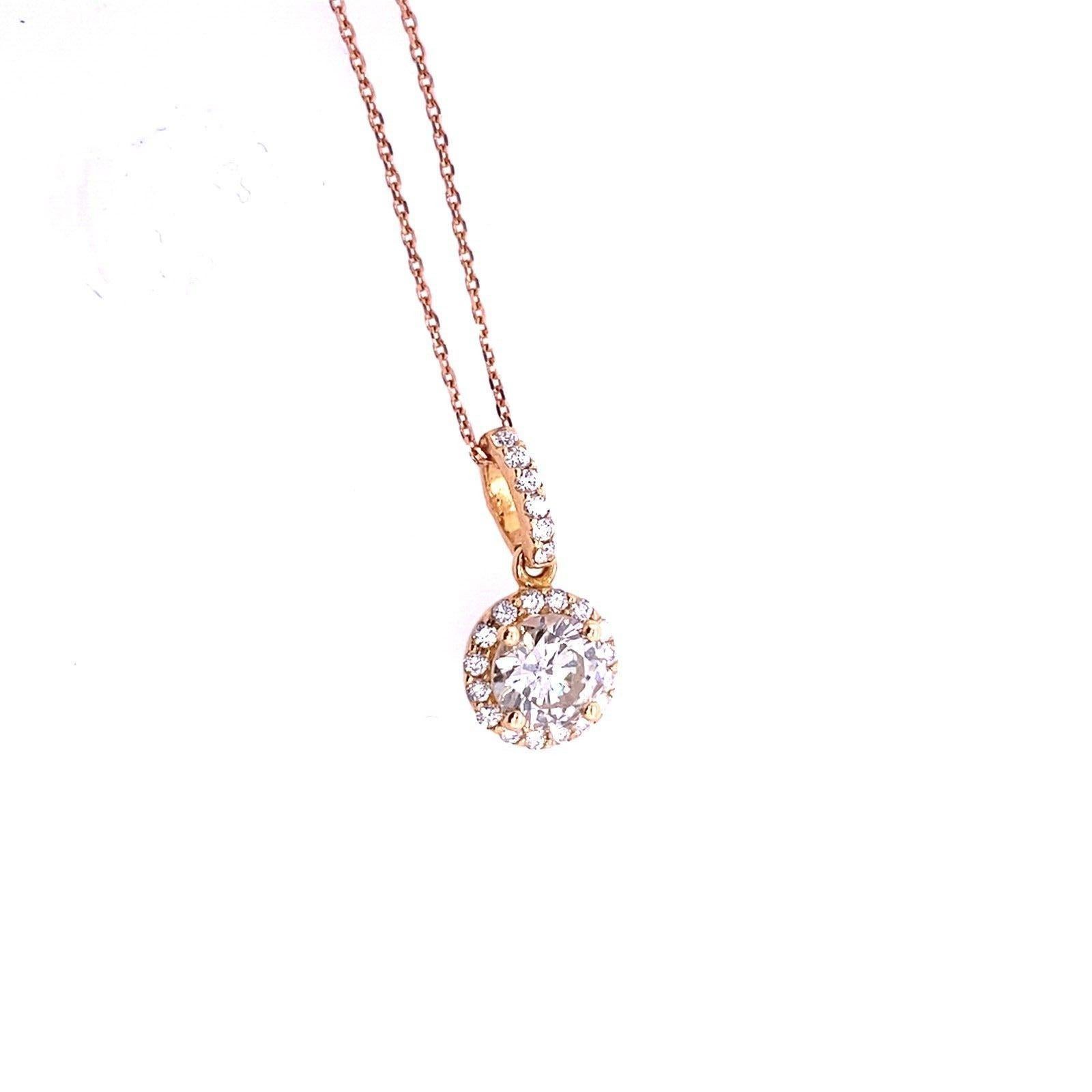 Fine Quality 0.75ct Round Brilliant Cut Diamond Pendant Set in 18ct Rose Gold

This 0.75ct diamond pendant set in 18ct Rose Gold is unique and elegant design, this diamond pendant comes with a diamond halo setting that magnifies the radiance and