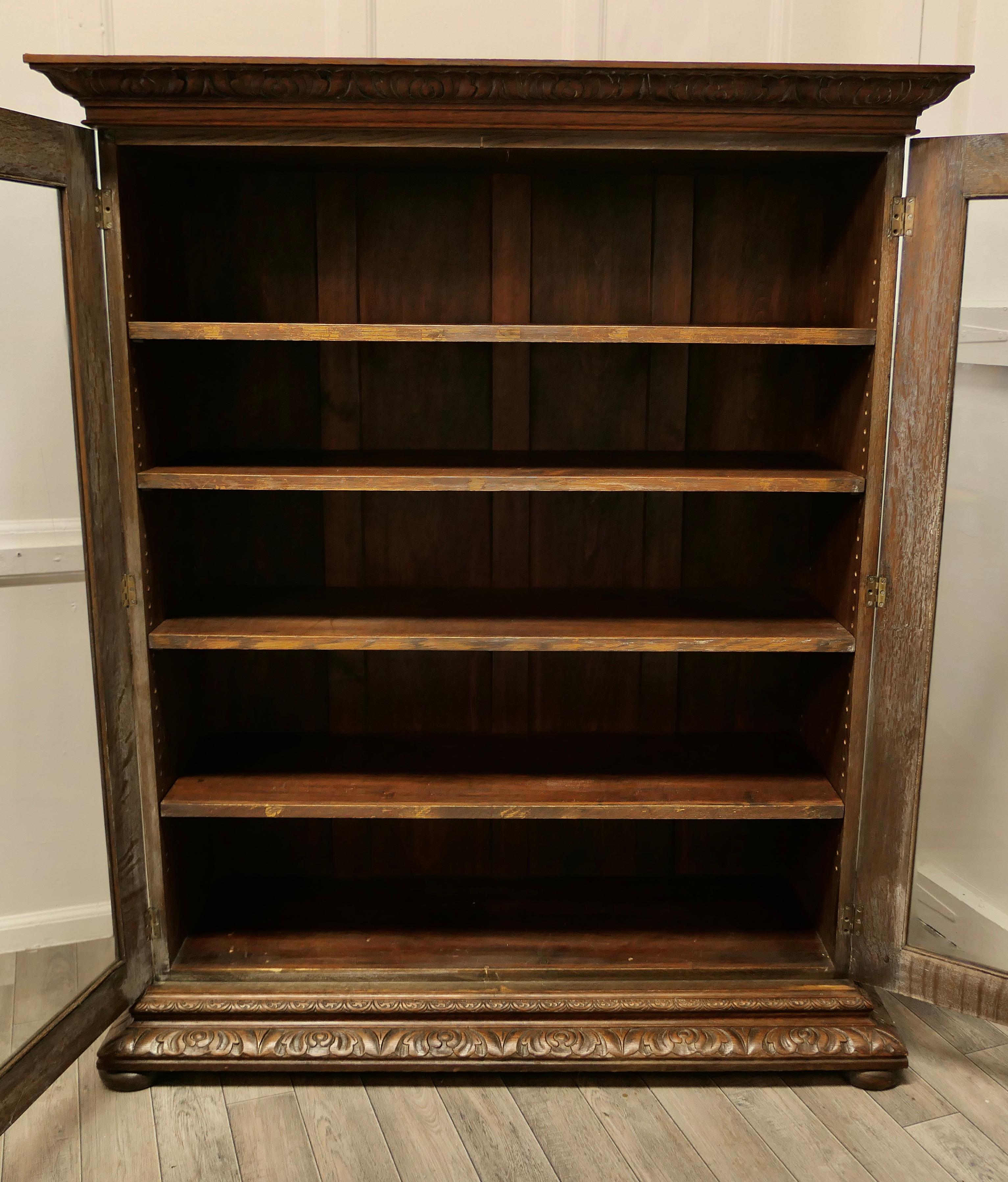 Fine Quality 19th Century Carved Oak Glazed Bookcase For Sale 1