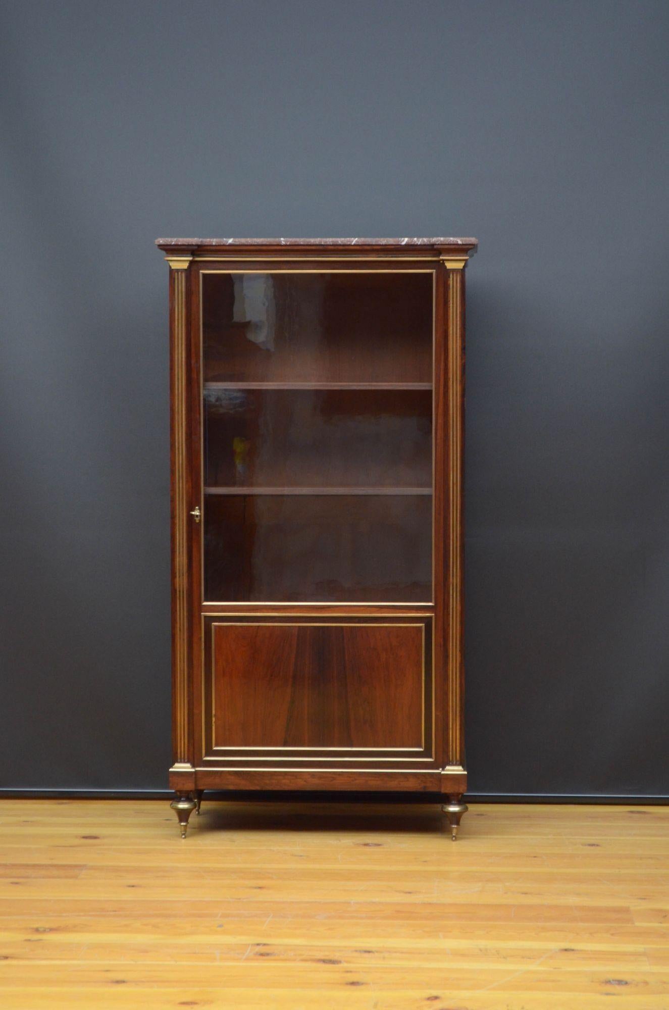 Sn5336 Fine quality French display cabinet / bookcase in rosewood, having original veined marble top above glazed door fitted with original working lock and a key and enclosing three height adjustable shelves, all flanked by reeded and brass inlaid