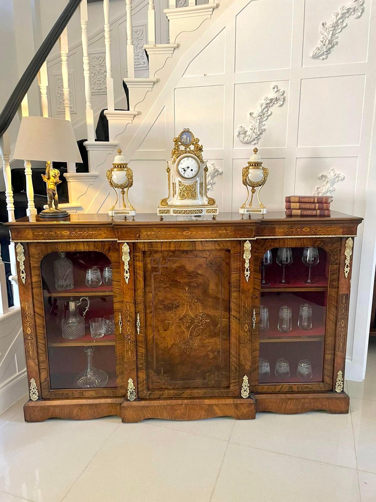 Fine quality Victorian antique burr walnut inlaid credenza having a beautiful walnut top, a superior boxwood inlaid shaped frieze and fabulous quality ormolu mounts. It boasts an exquisite quality burr walnut boxwood inlaid centre door and two