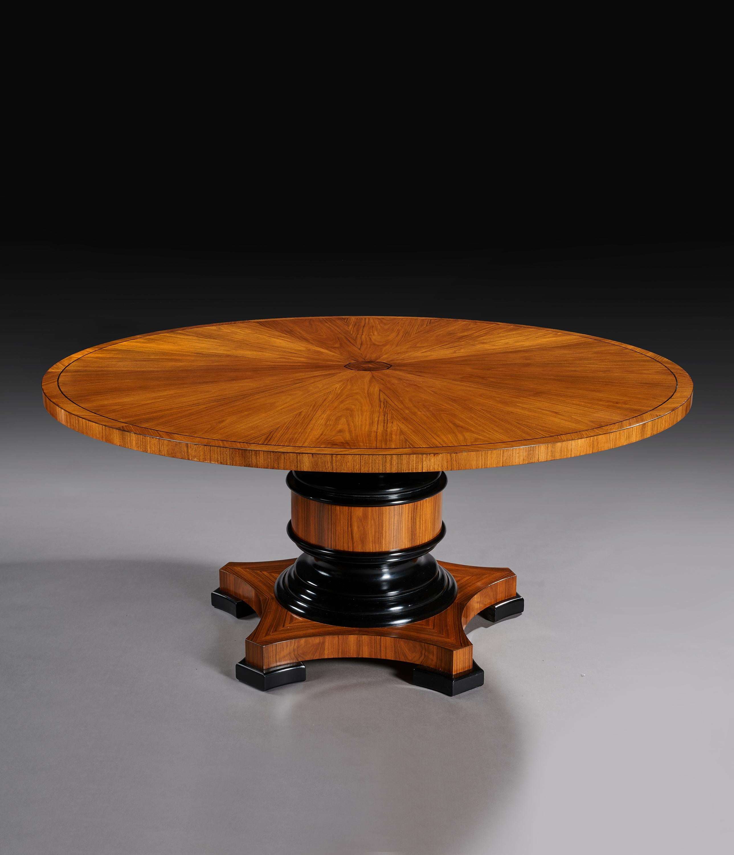 Very good quality bespoke made 5 1/2 foot olive wood veneered and ebony inlaid circular dining table.

English, late 20th century.

Extremely good quality, this English bespoke made large circular dining table has a diameter of 66 inches or 5