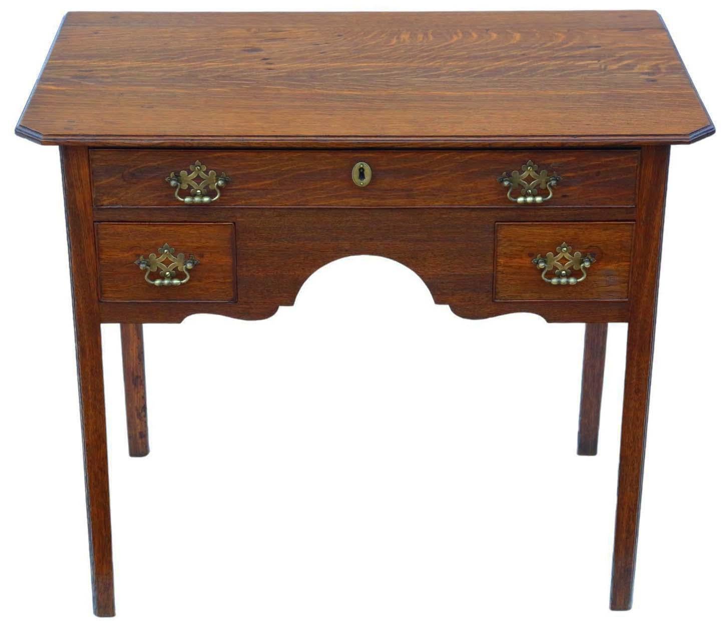 Introducing an Antique Fine Quality 19th Century Oak Writing Table, which also serves as a desk, dressing lamp, or large bedside table, showcasing a classical Georgian design.

Recently restored, the finishes of this exceptional piece are