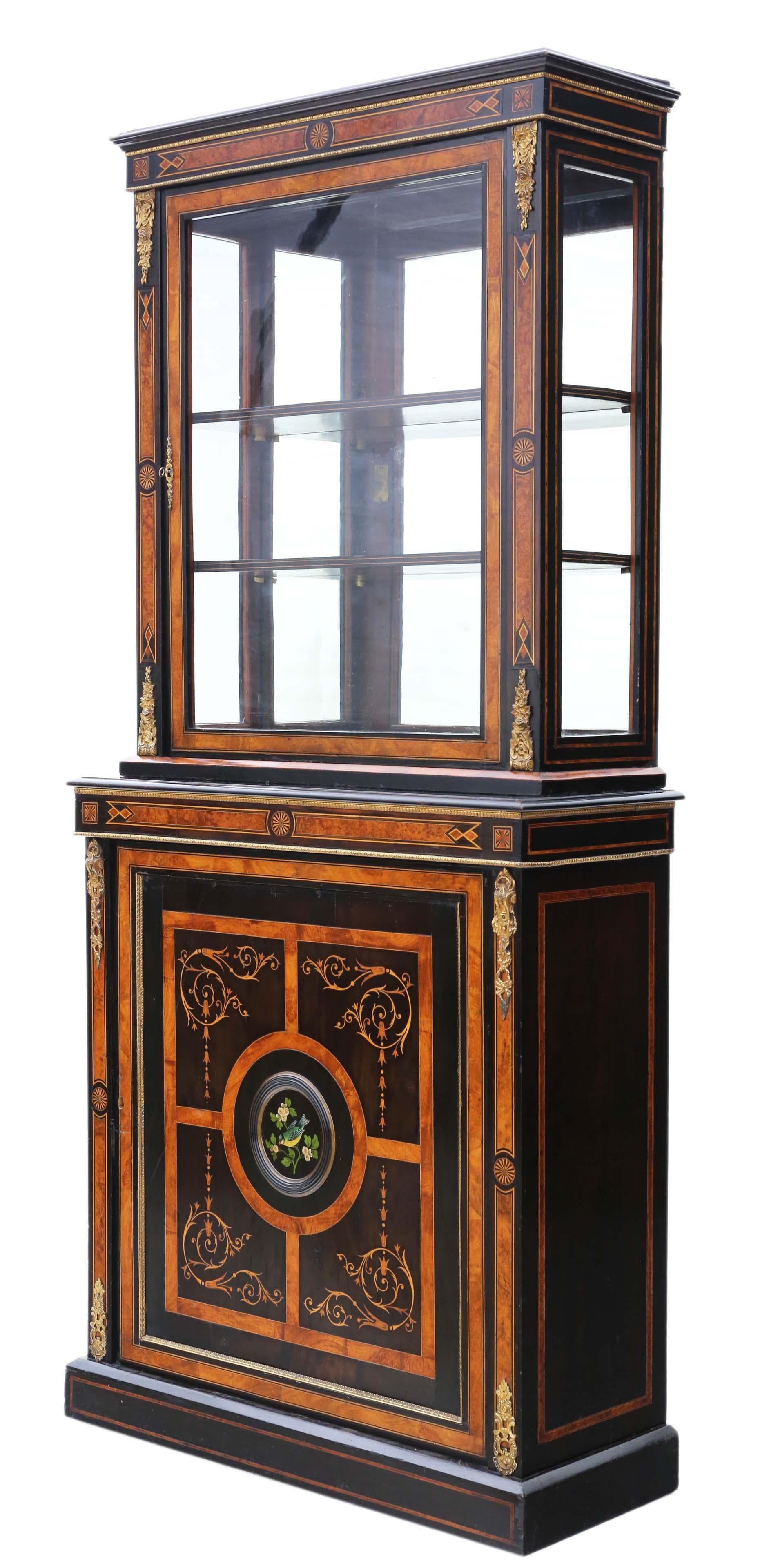Antique, fine-quality 2-part pier display cabinet from the Victorian Aesthetic period, approximately dating back to 1880, crafted with amboyna and ebonized wood. This cabinet stands out as a very rare find, adorned with prolific detailed marquetry