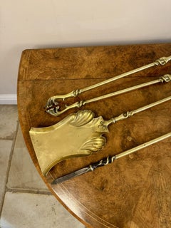 Fine quality antique Edwardian brass fire irons and fire dogs