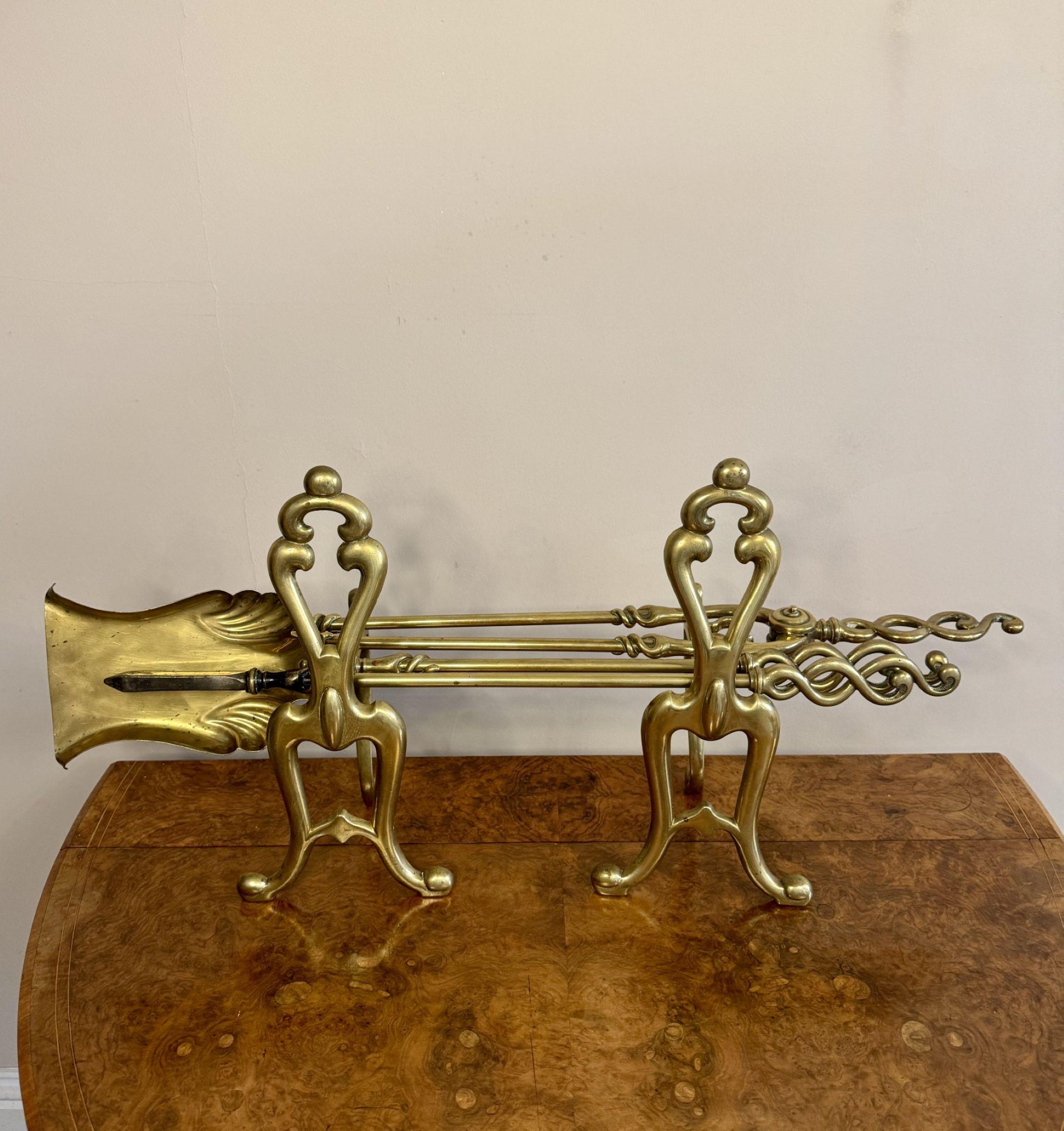 Fine quality antique Edwardian brass fire irons and fire dogs For Sale