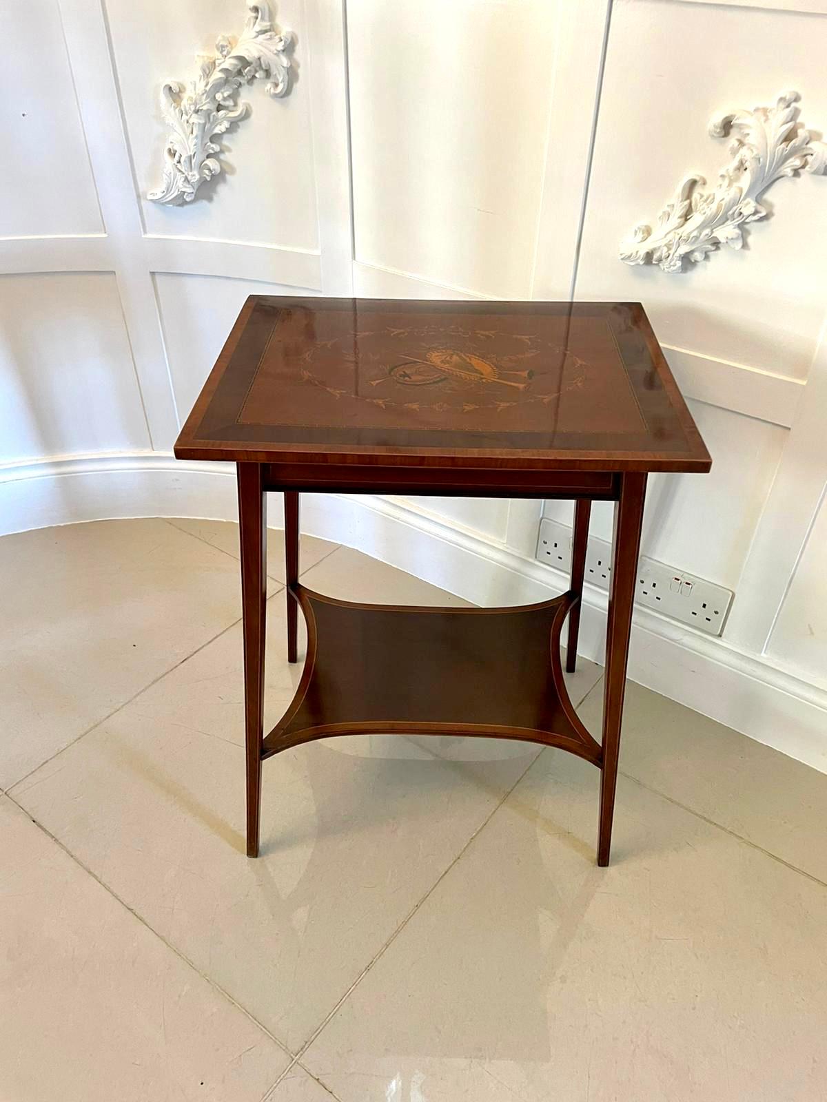 Fine quality antique Edwardian mahogany inlaid lamp table having a fine quality mahogany marquetry inlaid rectangular shaped crossbanded top, mahogany frieze and standing on four square mahogany inlaid tapering legs united by a shaped mahogany