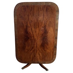 Fine quality Antique figured mahogany brass inlaid dining table