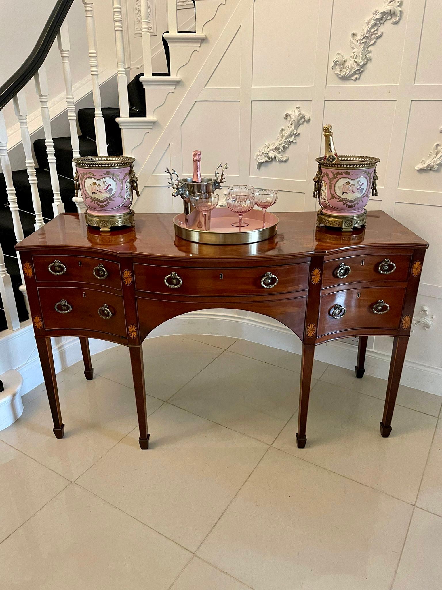 Fine quality antique 18th century George III mahogany inlaid serpentine shape sideboard having a figured mahogany serpentine shaped top above a bow fronted centre drawer flanked by a serpentine shaped cellarette drawer and two oak lined drawers with
