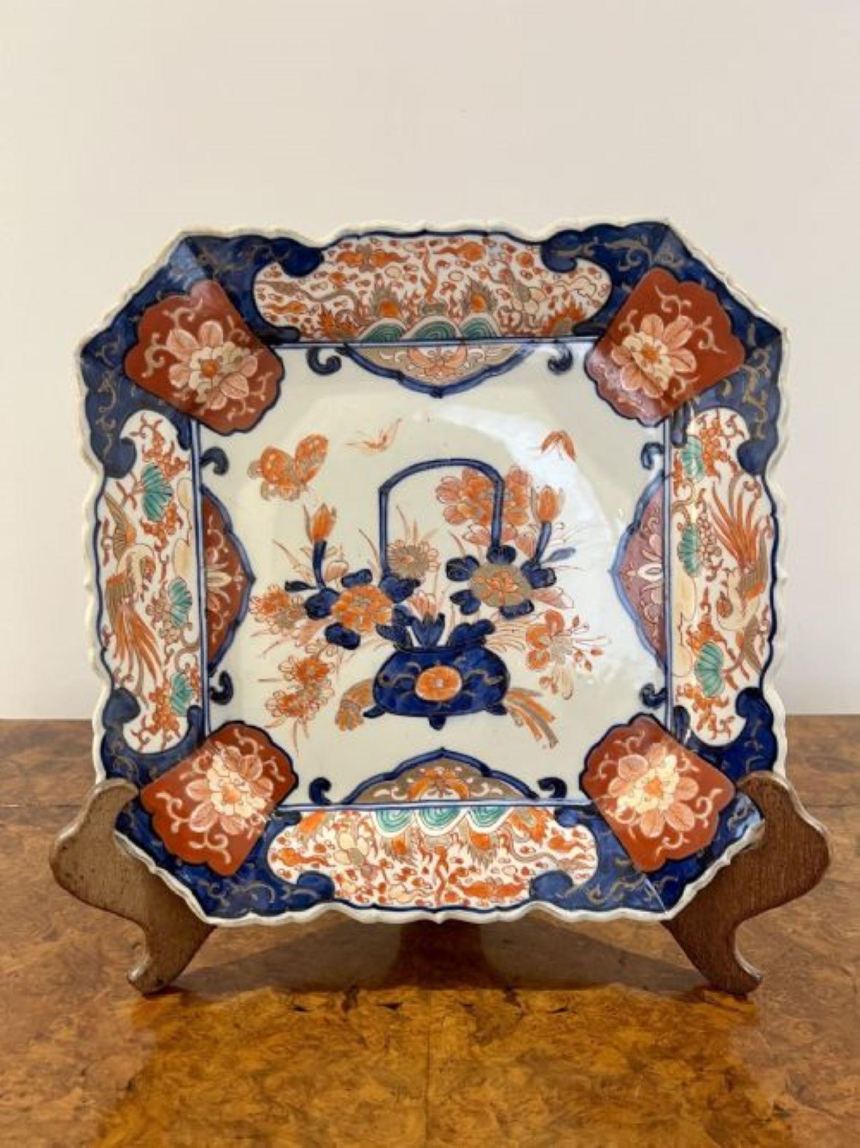 Fine Quality Antique Hand Painted Japanese Large Imari square Plate. Having a shaped scalloped edge with quality hand painted panels, with a vase of flowers and leaves to the centre, in wonderful Red, Blue, Gold, Orange and White colours.