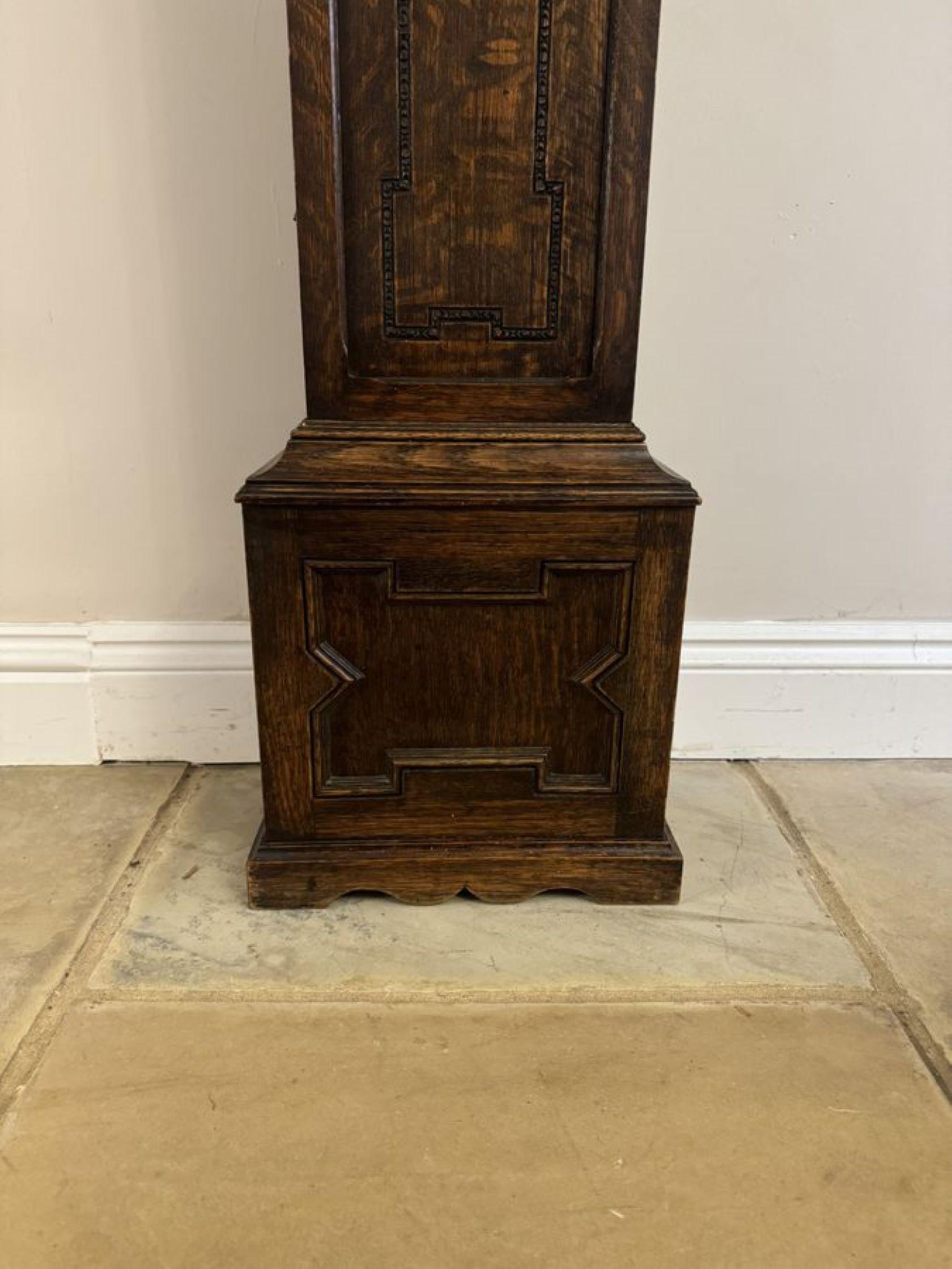 Fine Quality antique Oak 8 Day Chiming Grandmother Clock, having a superb quality oak case with beautiful carved detail, fine barley twist columns to the sides of the silvered dial within a ornate brass face with the original hands. Chiming movement
