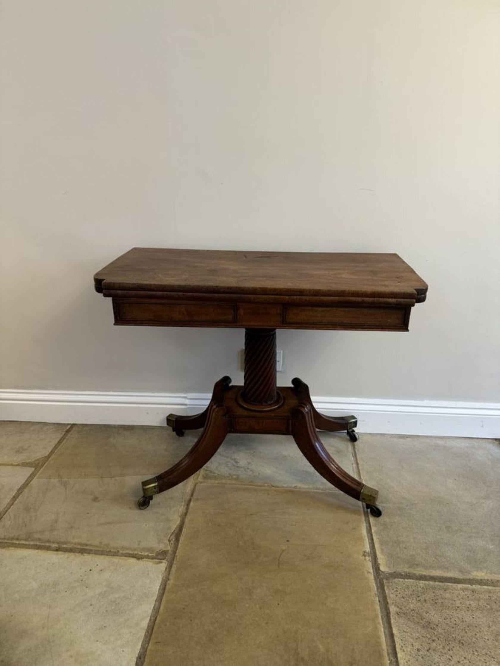 Fine quality antique regency mahogany tea table, having a quality mahogany shaped swizzle top opening to reveal a polished interior, mahogany frieze supported by a rope twist mahogany pedestal column standing on a platform base with four reeded