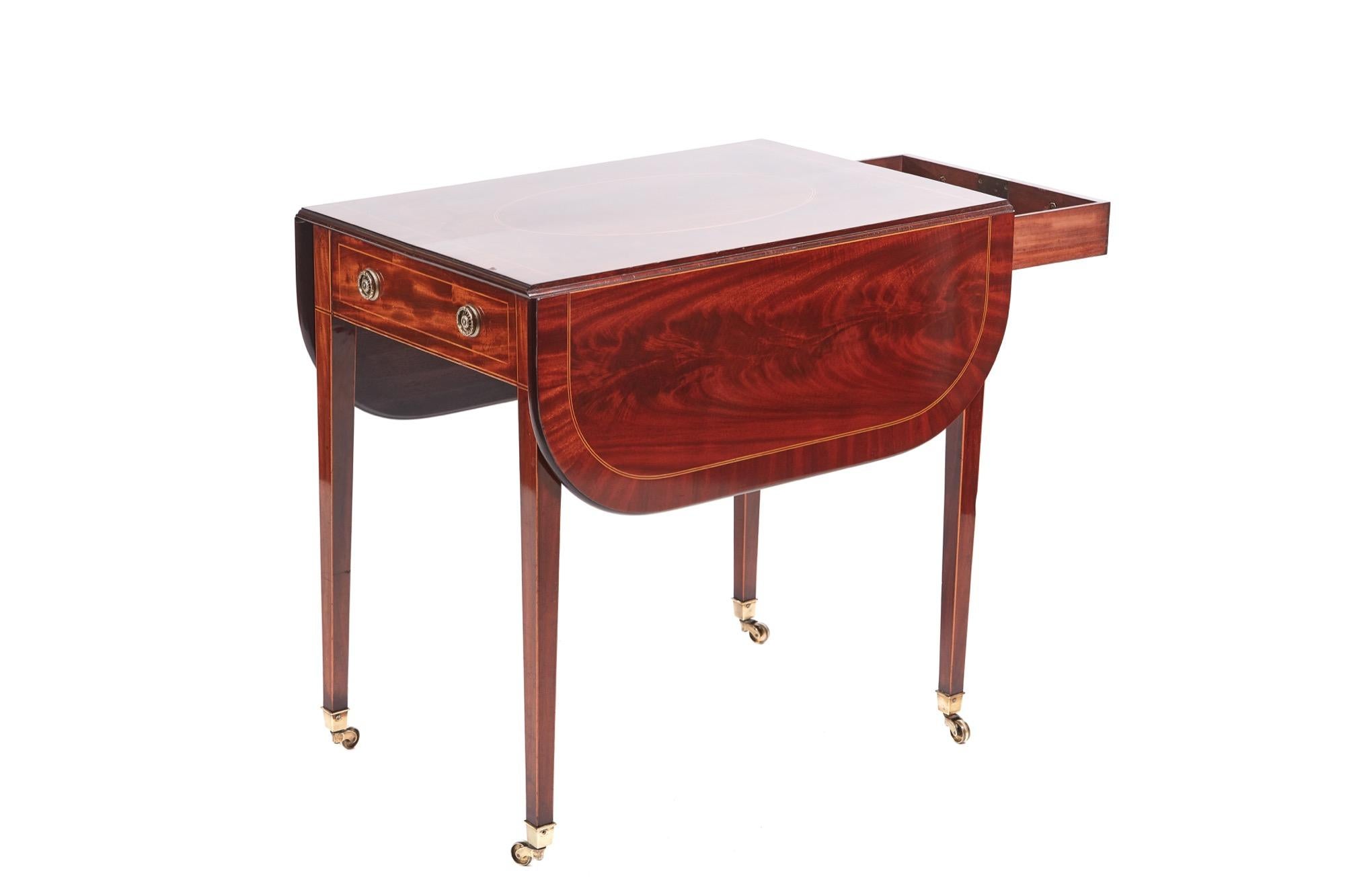 Fine quality Sheraton antique period inlaid mahogany Pembroke table with an outstanding quality inlaid top with two drop leaves, one-drawer and one dummy drawer to the frieze with original brass handles. It stands on four square tapering inlaid legs