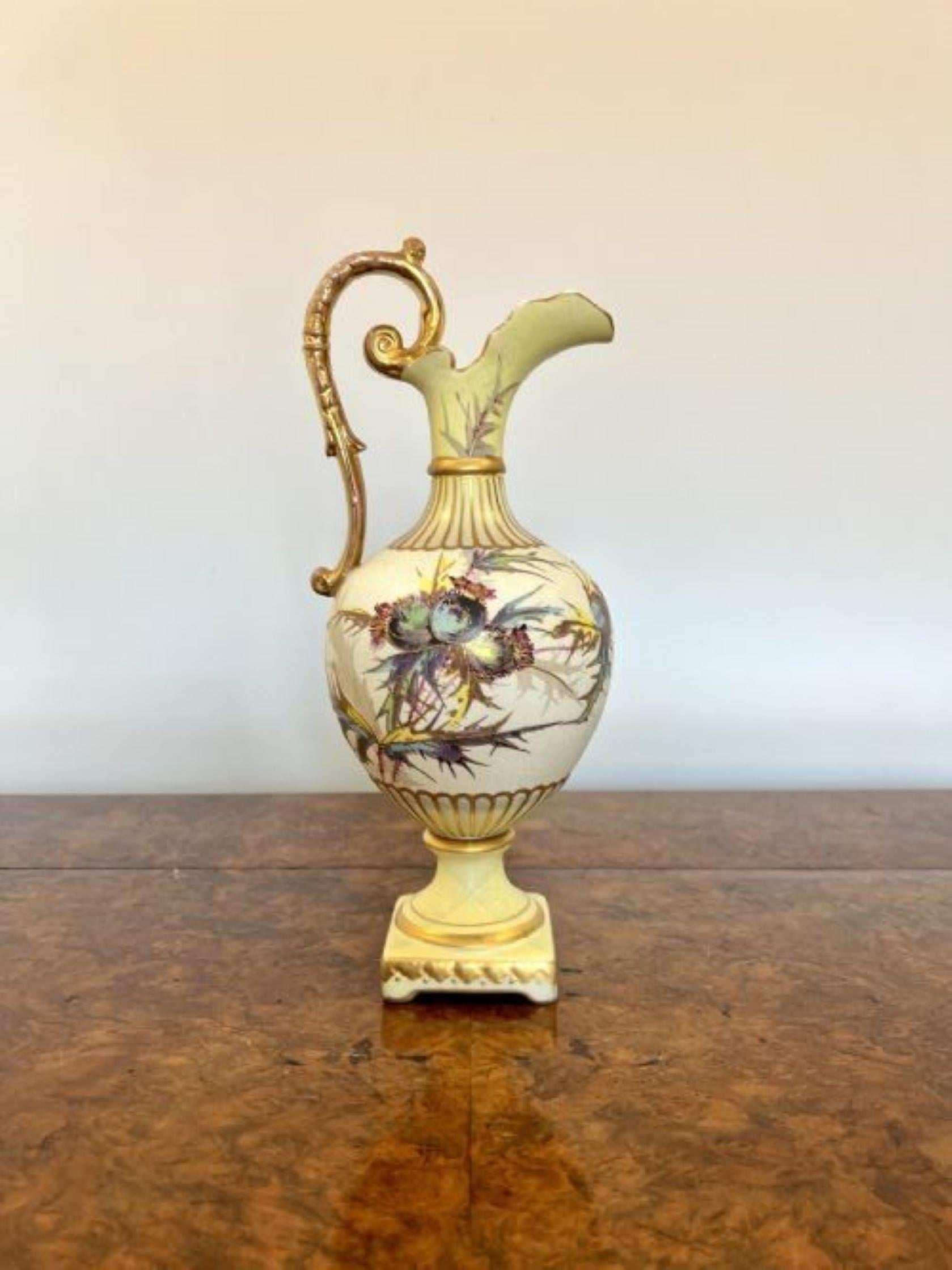 Fine quality antique Victorian ewer having a quality antique Victorian ewer with a fantastic hand painted body in wonderful yellow, blue, green and gold colours raised on a square gilded base with a shaped gilded handle to the back and a shaped