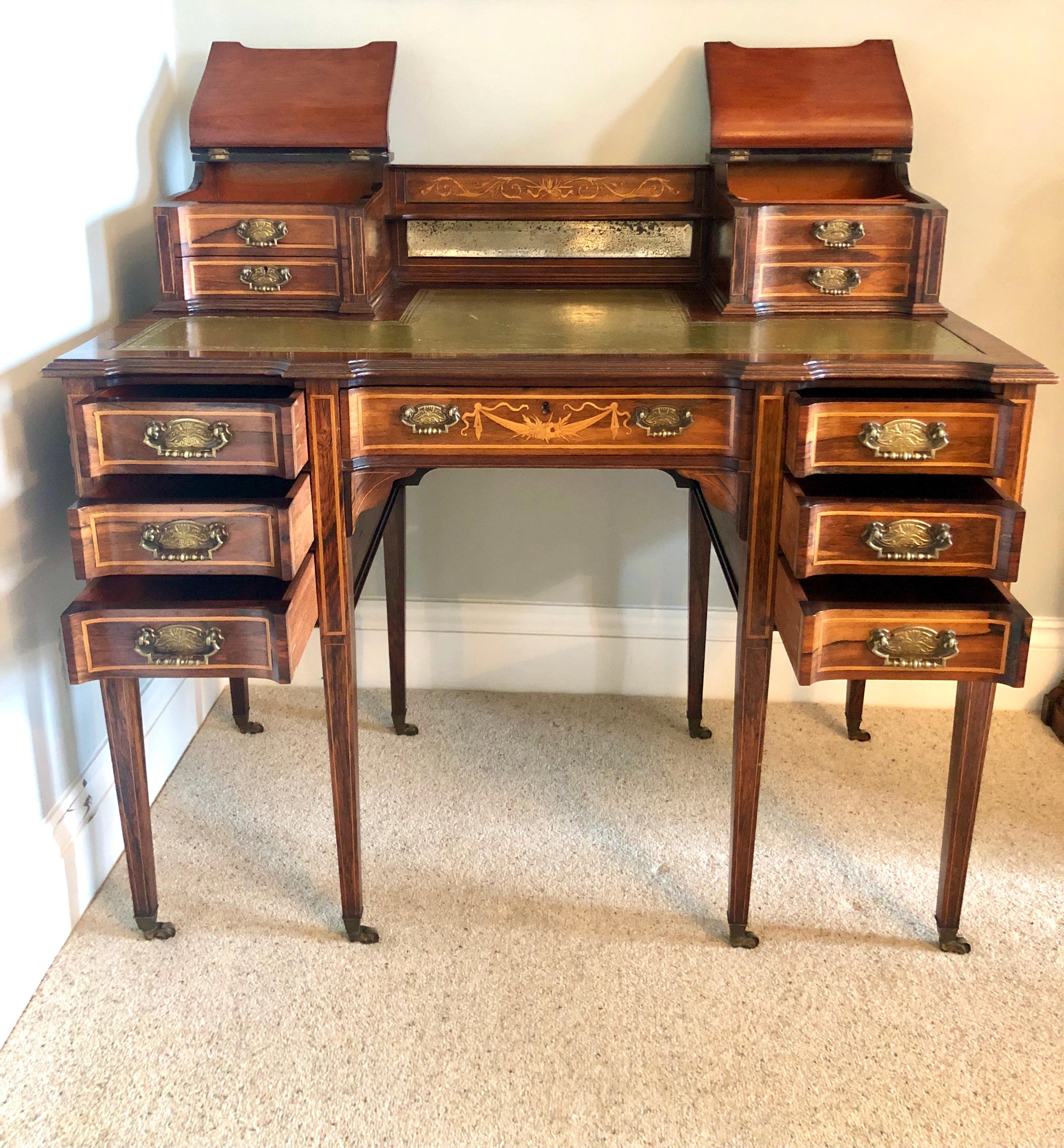 Fine quality Victorian freestanding rosewood Maple & Co. inlaid writing desk having original pierced brass galleries, mirror to the centre with a pretty inlaid rail above, flanked by two faux drawers to the right, one faux and one opening drawer to