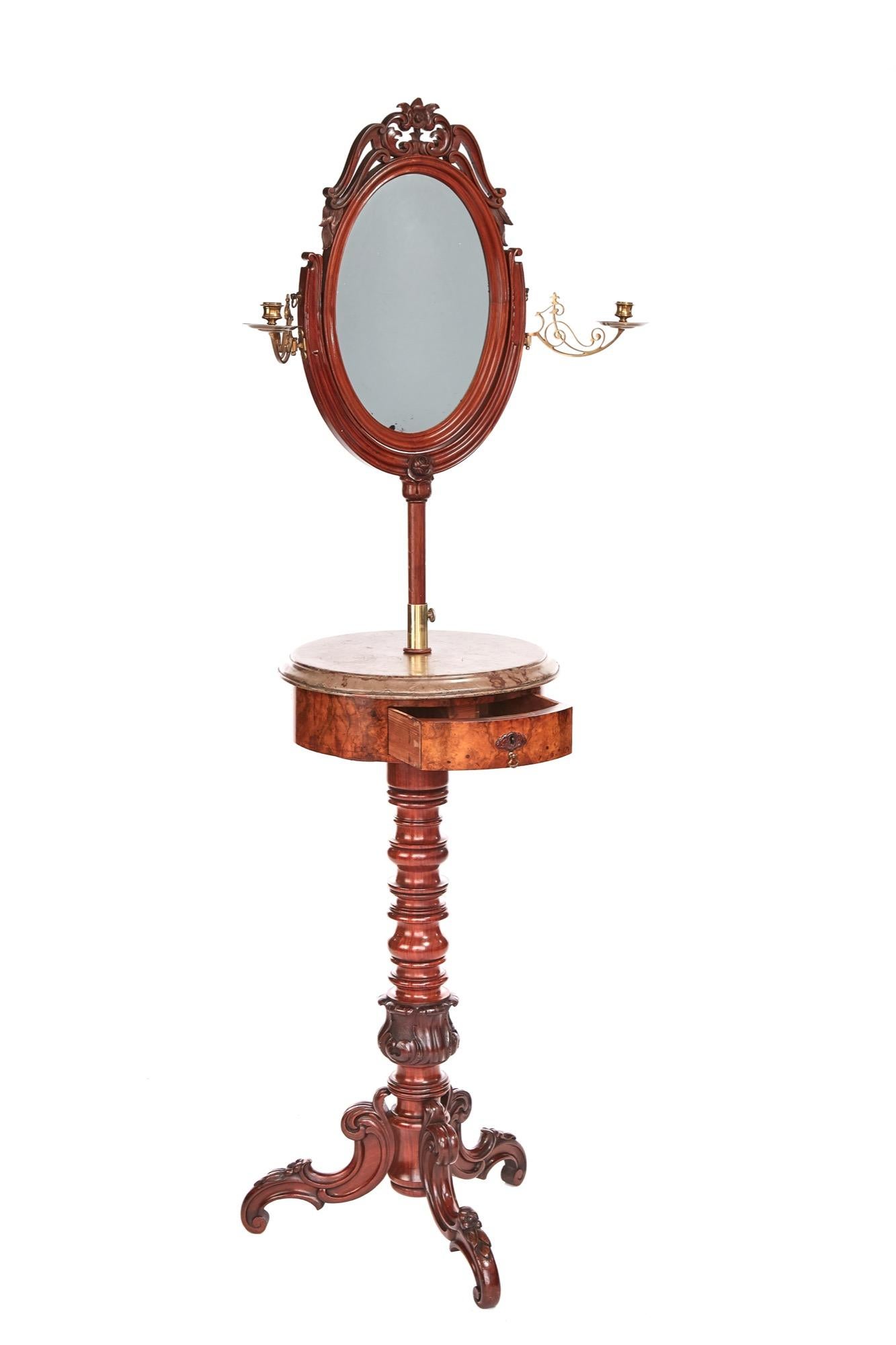 Fine quality Victorian mahogany and walnut telescopic dressing stand with a stunning oval mahogany framed swing mirror with ornate carving to the top. It is supported on a U-shaped elegant telescopic frame with brass candle sconces each side and a
