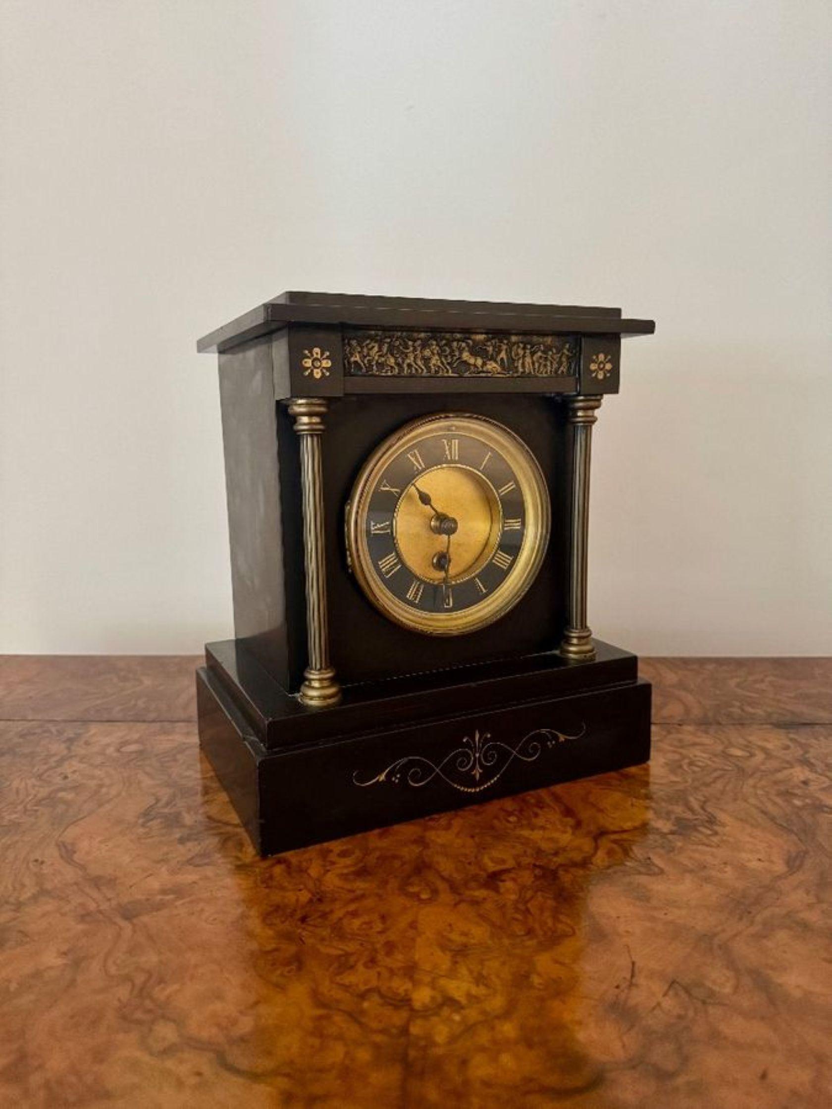 Fine quality antique Victorian mantle clock, having a fine quality antique Victorian mantle clock with a black case with gilt metal columns to the side of the black dial with gold Roman numerals and the original black spade hands, raised on a square