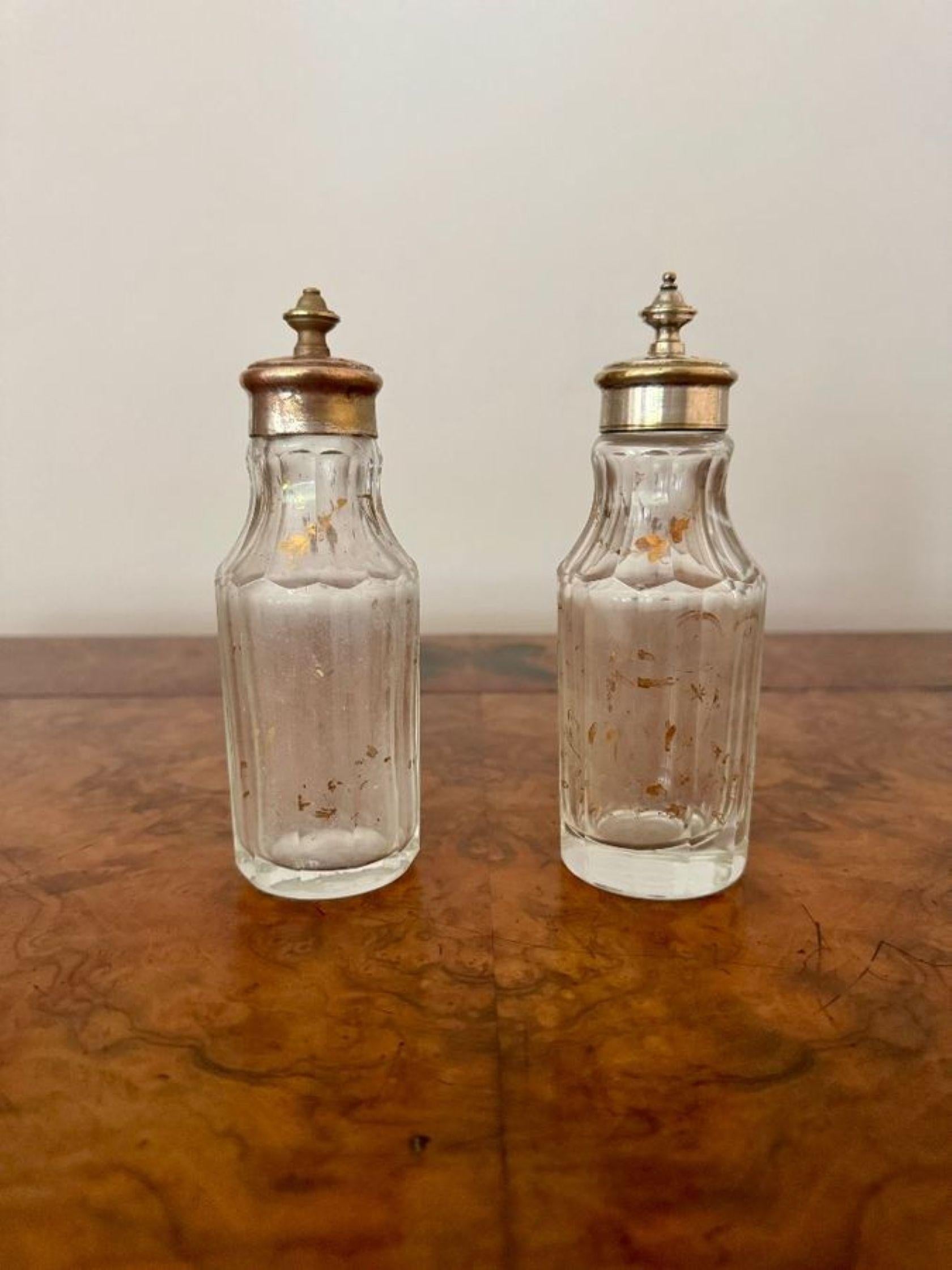 Fine quality antique Victorian ornate silver plated cruet set with a unusual ornate silver plated stand raised on four decorative legs with scrollwork and relief detailing, with a shaped ornate carrying handle to the centre, next to the bottle