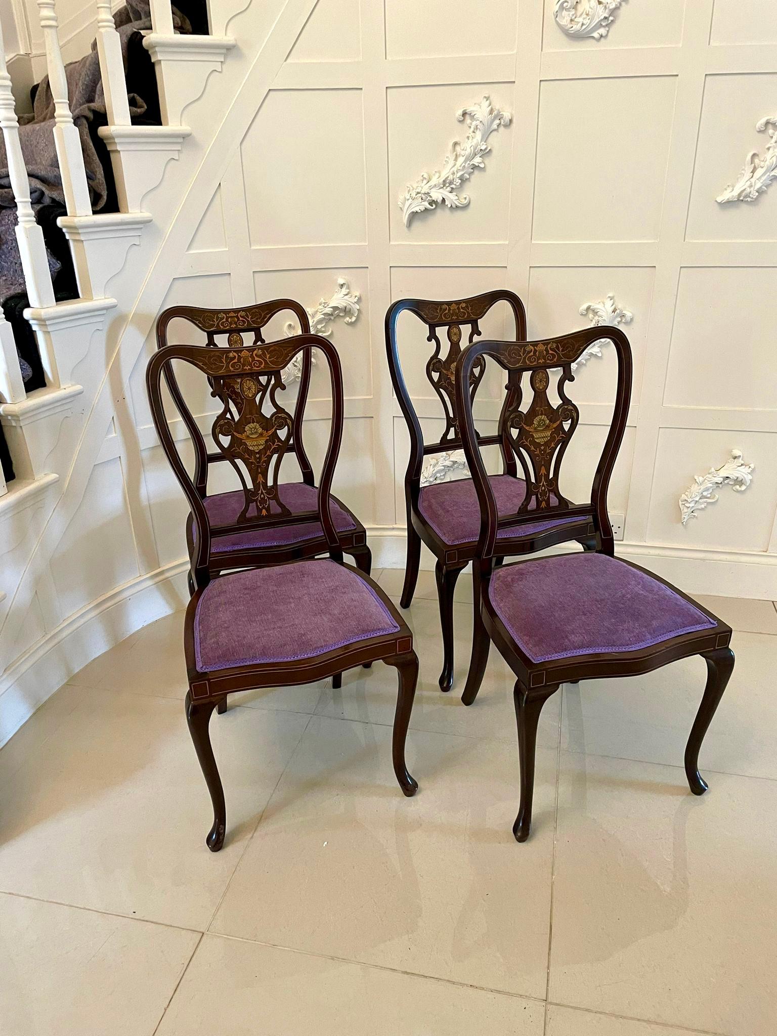 Fine quality antique Victorian set of four marquetry inlaid chairs having pretty shaped backs with fine quality marquetry inlay, newly reupholstered serpentine shaped seats in a quality fabric, inlaid frieze and standing on elegant shaped cabriole