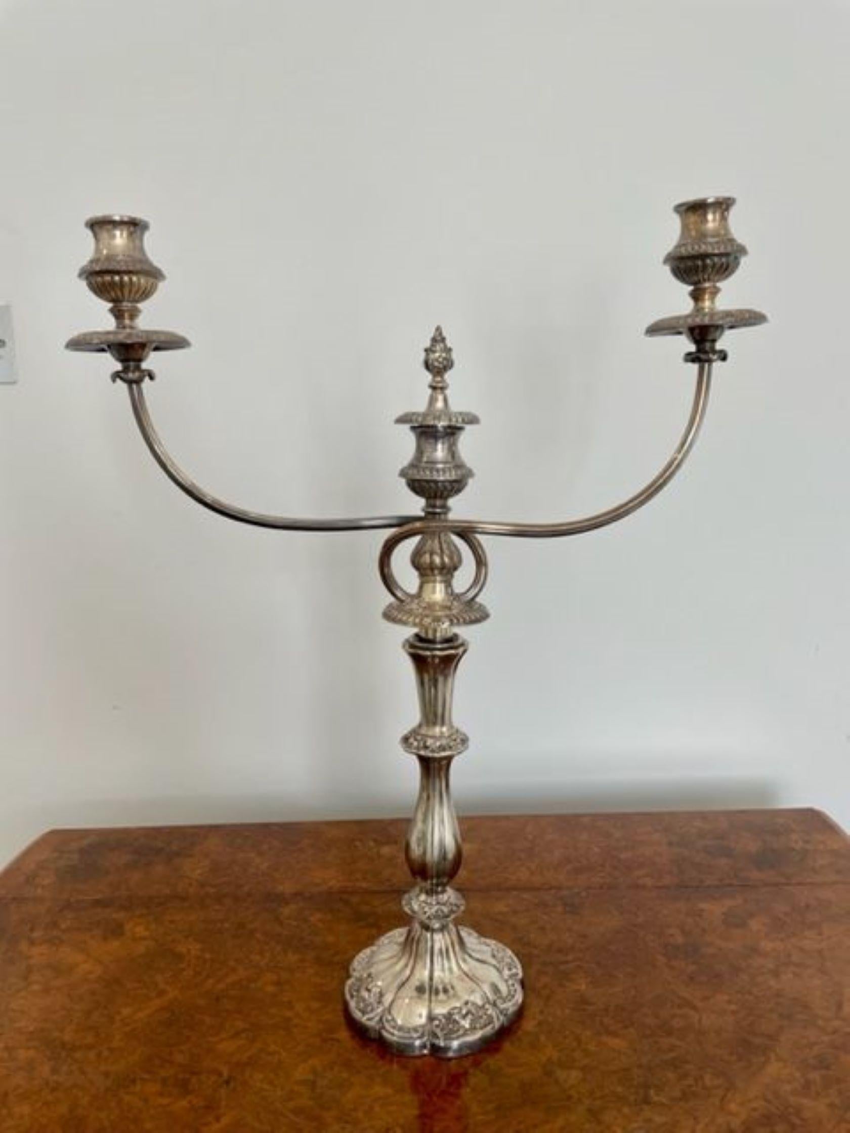 Fine quality antique Victorian silver plated candelabra having a quality ornate base and a shaped reeded column with a two branch candelabra with a center candle holder with a removable finale.