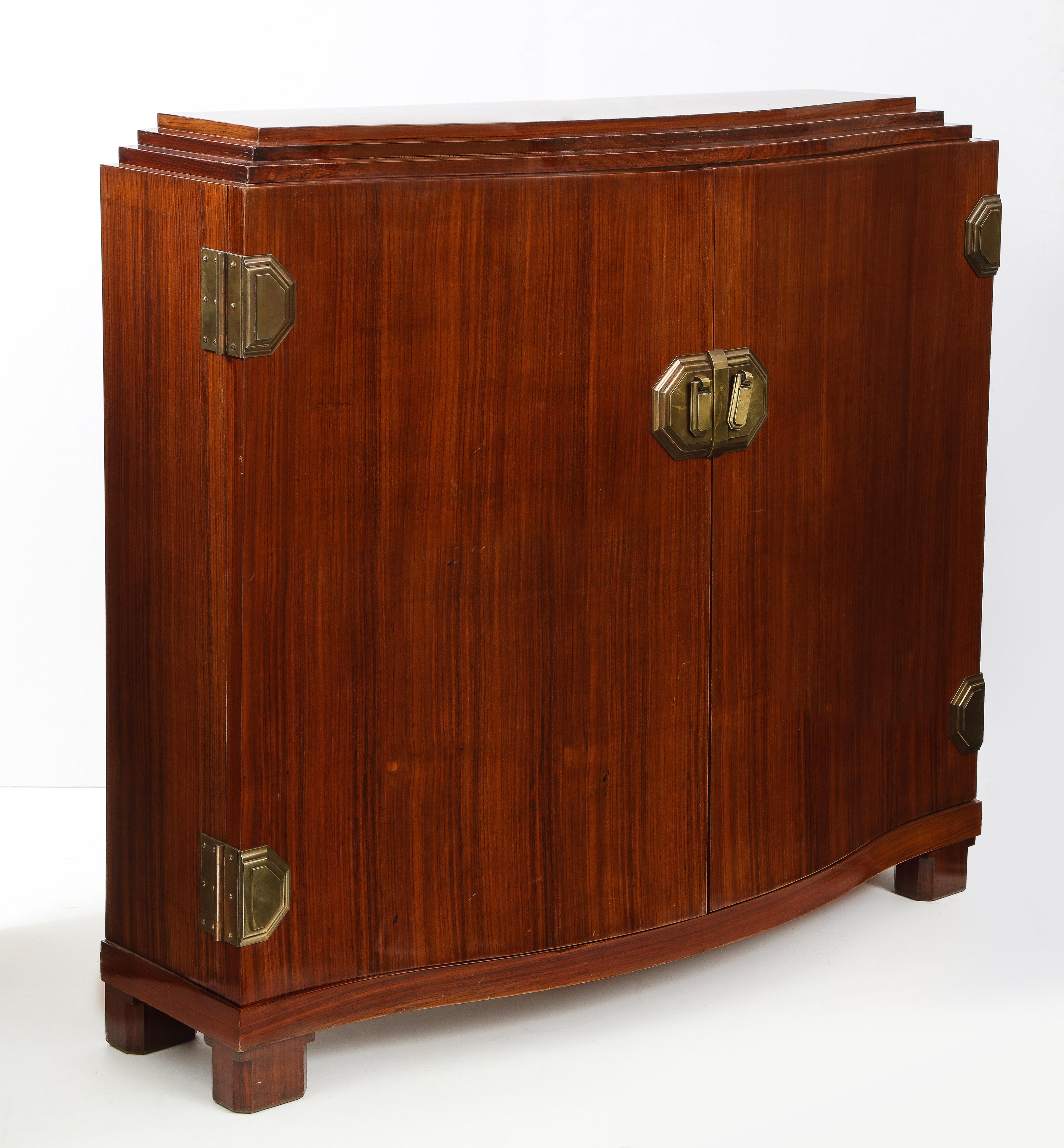Fine quality Art Deco walnut two-door cabinet decorated with patinated bronze handles and hinges, attributed to Maison Dominique.
       