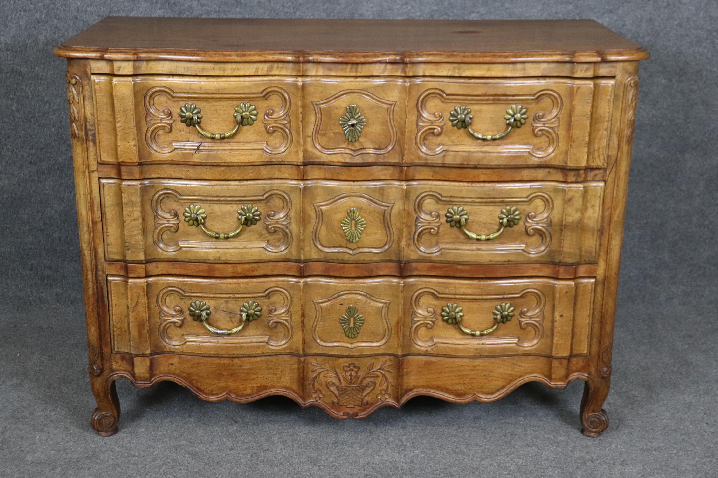 This is a superbly crafted hand-carved details in the French provincial style and looks like it was done by Auffray furniture of New York. The carving quality is exceptional, and the wood quality is equally exceptional. Measures 47.75 wide x 20.5