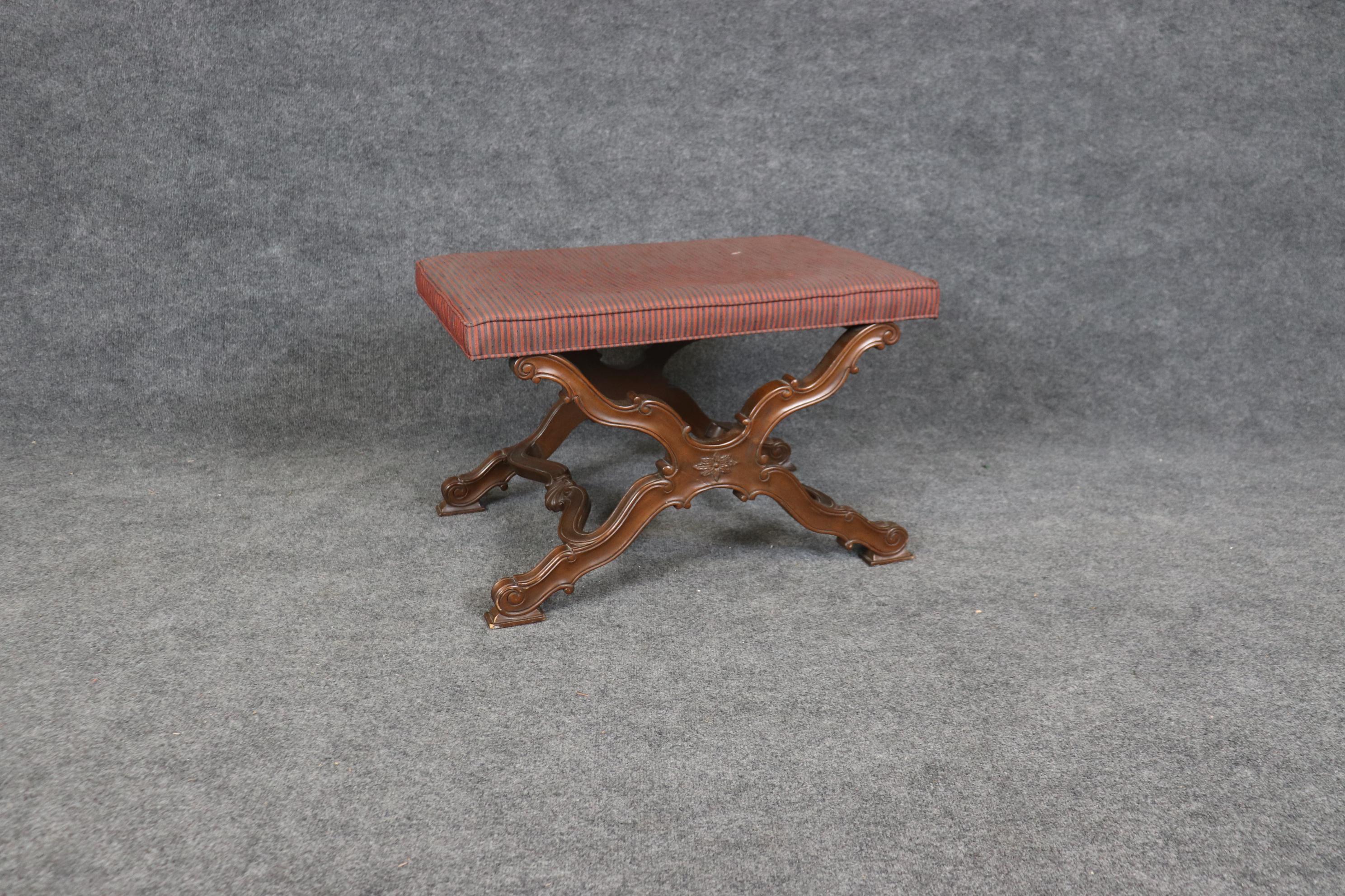 This is s superb quality carved Baker furniture company French Regency style stool or bench. The bench is in its original finish and upholstery and yet remains in good condition and will show minor signs of wear, scuffs around the feet and and