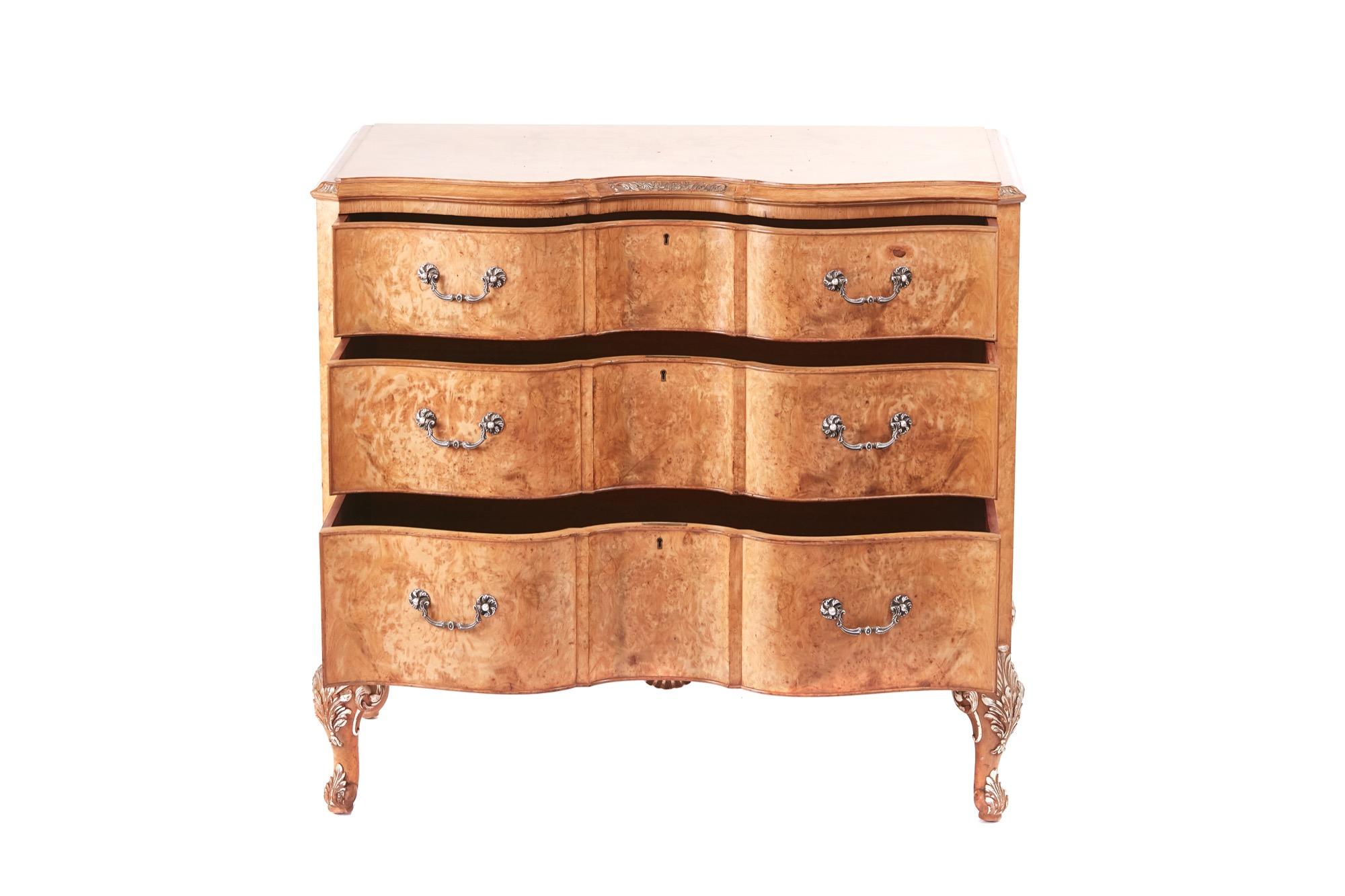 Fine quality bird's-eye maple serpentine shaped chest of drawers, having a lovely quality bird's-eye maple top with a moulded and carved edge, three long serpentine shaped drawers with original silver plated handles, shaped apron with carved walnut