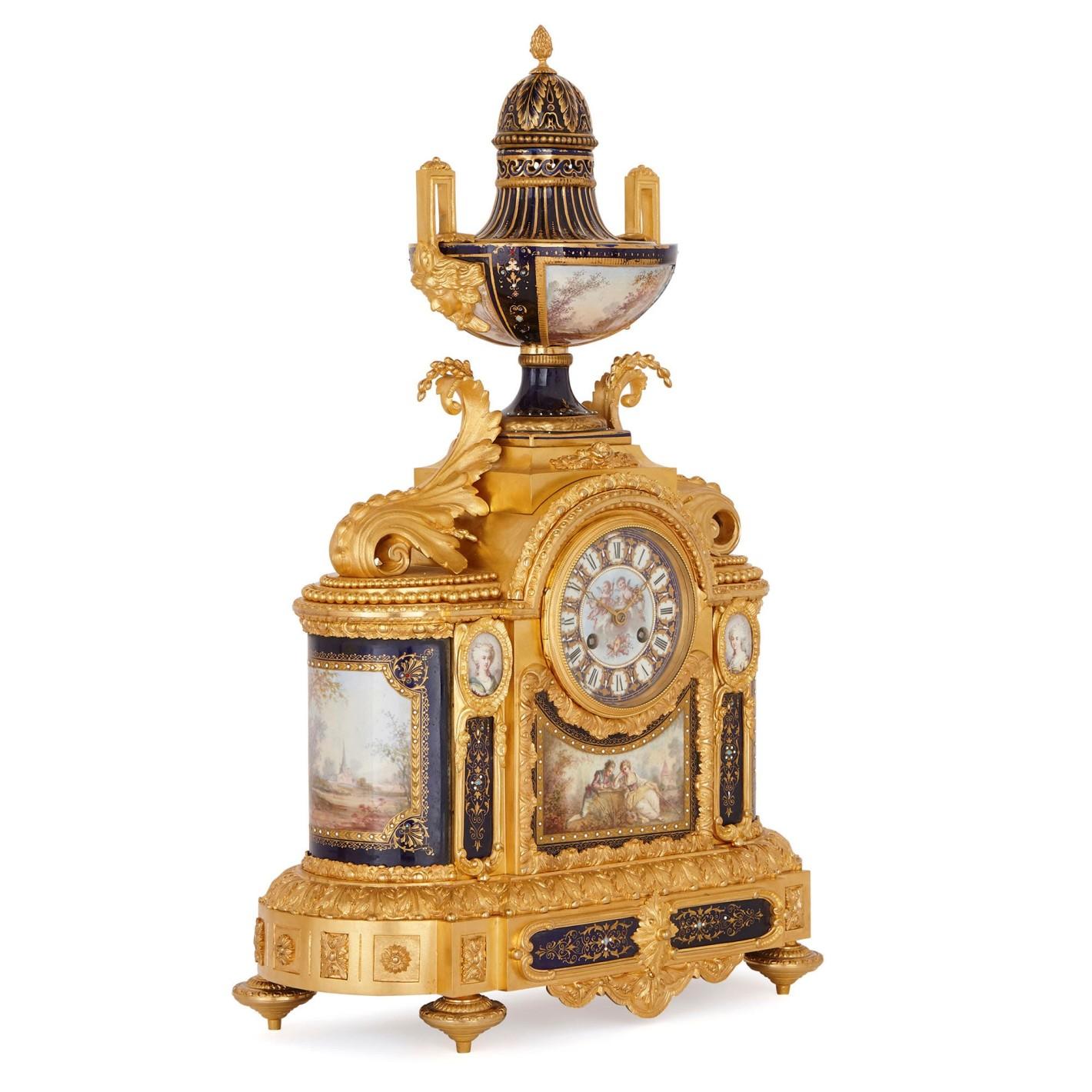 A fine quality 19th century French Sevres style porcelain and gilded ormolu clock garniture. The pair of five branch gilded ormolu candelabra each having Sevres style porcelain urns and pedestals with classical romantic scenes painted on them. The