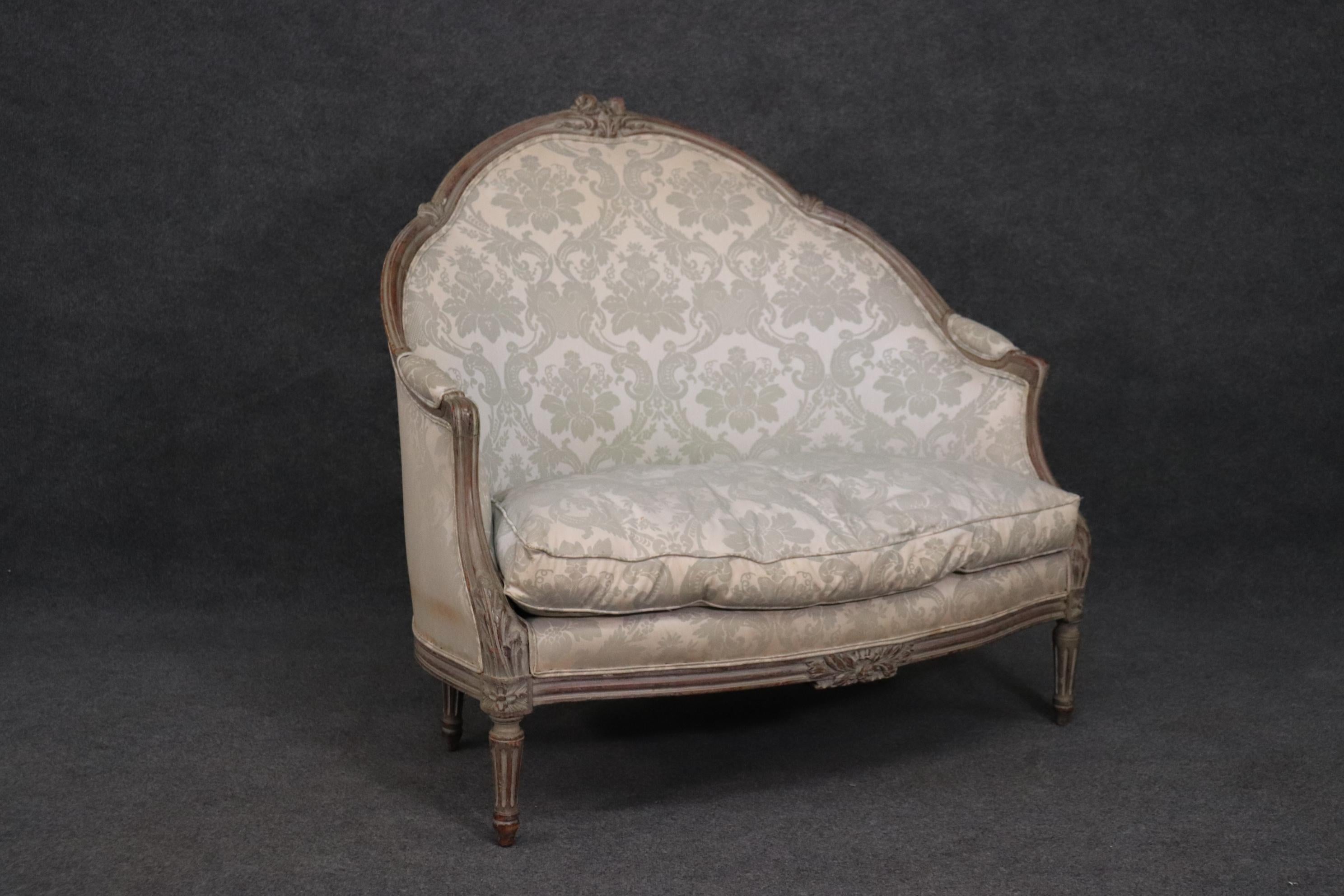 This is a superbly carved painted Louis XV style canape. The design and the carving are just spectacular and beautifully done. The upholstery is obviously not perfect but can be reupholstered. The frame measures 42 x 42 x 31 deep and teh seat height