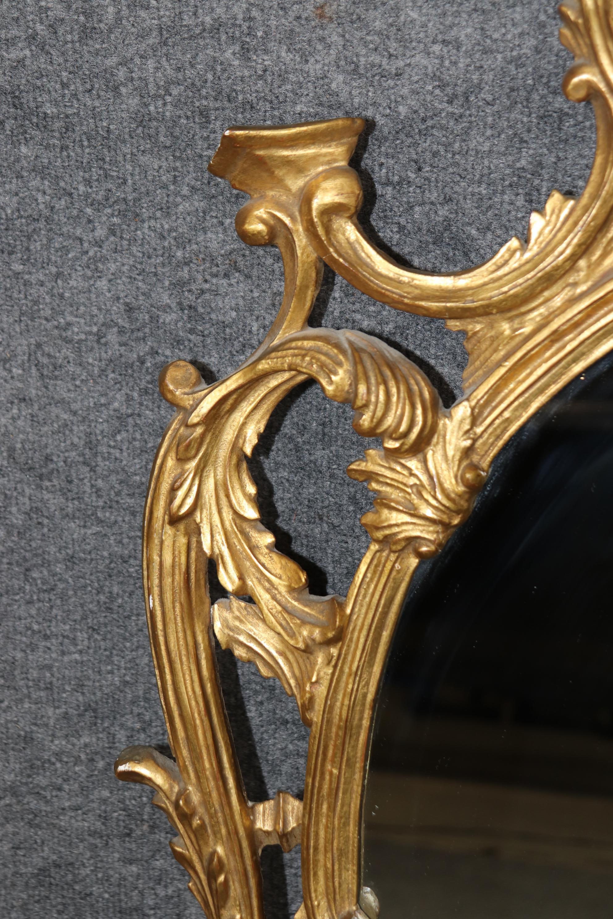 Louis XV Fine Quality Carved Italian Giltwood Mirror with Shell Motif Atop.  For Sale