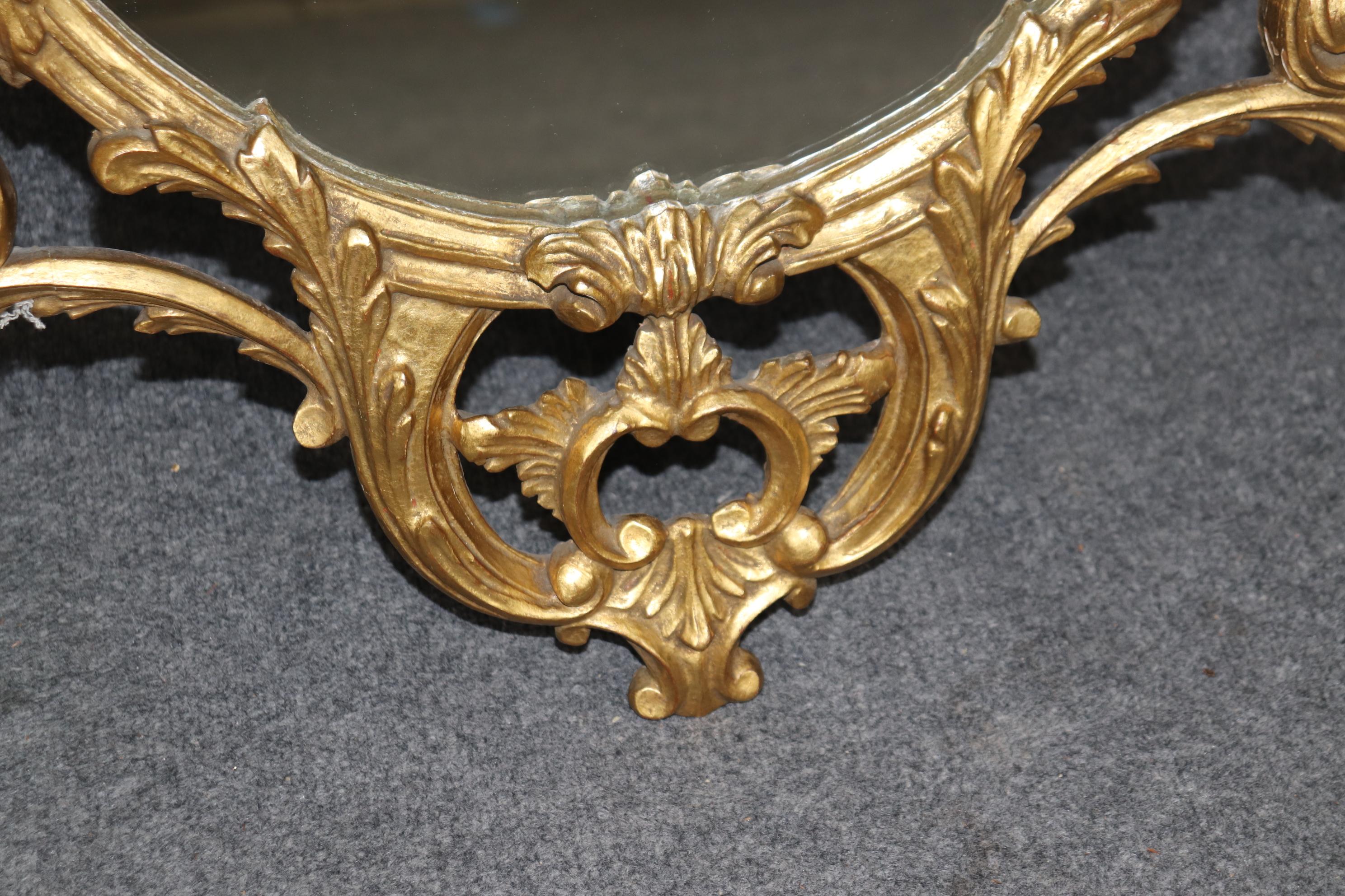 Fine Quality Carved Italian Giltwood Mirror with Shell Motif Atop.  In Good Condition For Sale In Swedesboro, NJ