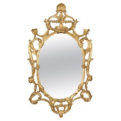 Fine Quality Carved Italian Giltwood Mirror with Shell Motif Atop.
