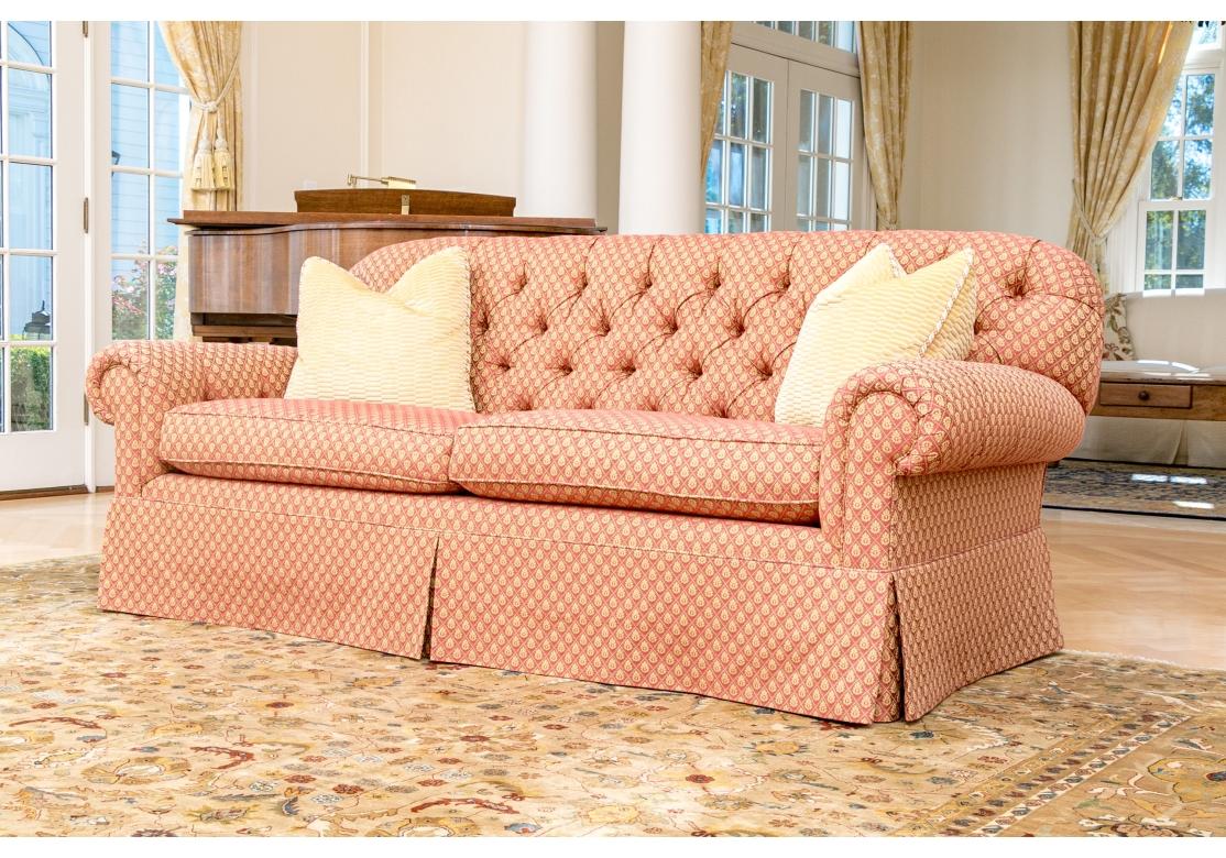 A very comfortable and well made Sofa with inset panel arms, tufted back and gently rounded back. The impeccable custom fabric treatment is a Diamond quilted deep Salmon background with repeating small Pale Yellow wreath type motif. Two very fine