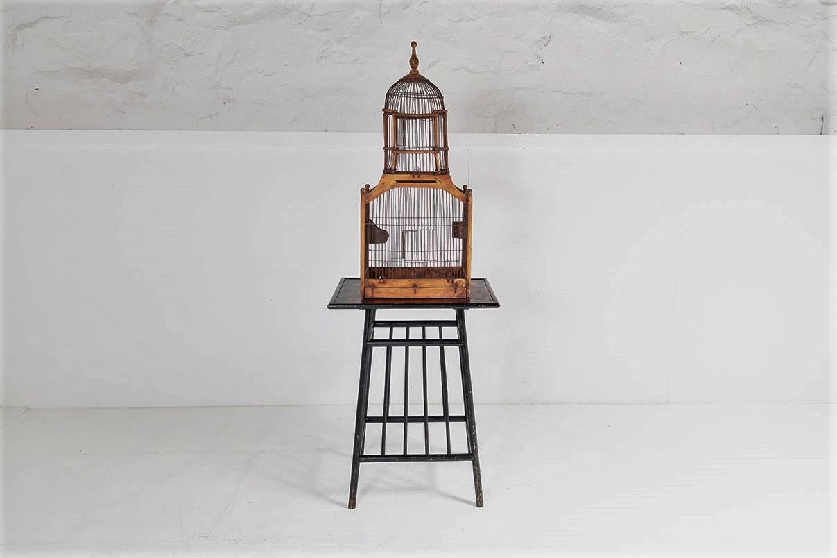 A lovely quality antique wooden bird cage in very good original condition.  Made from wood and wirework, this example has a lovely decorative shape with dome top and a beautiful aged warm tone to the wood.
Includes pull out tray and original